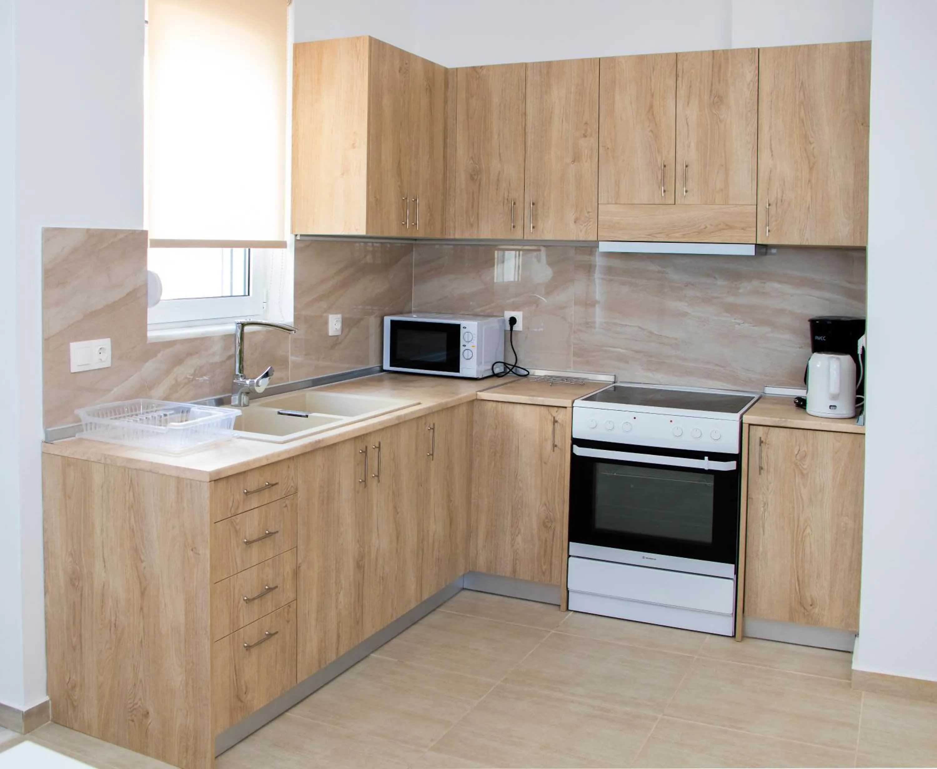 Kitchen or kitchenette in Gennadi Gardens exclusive apartments