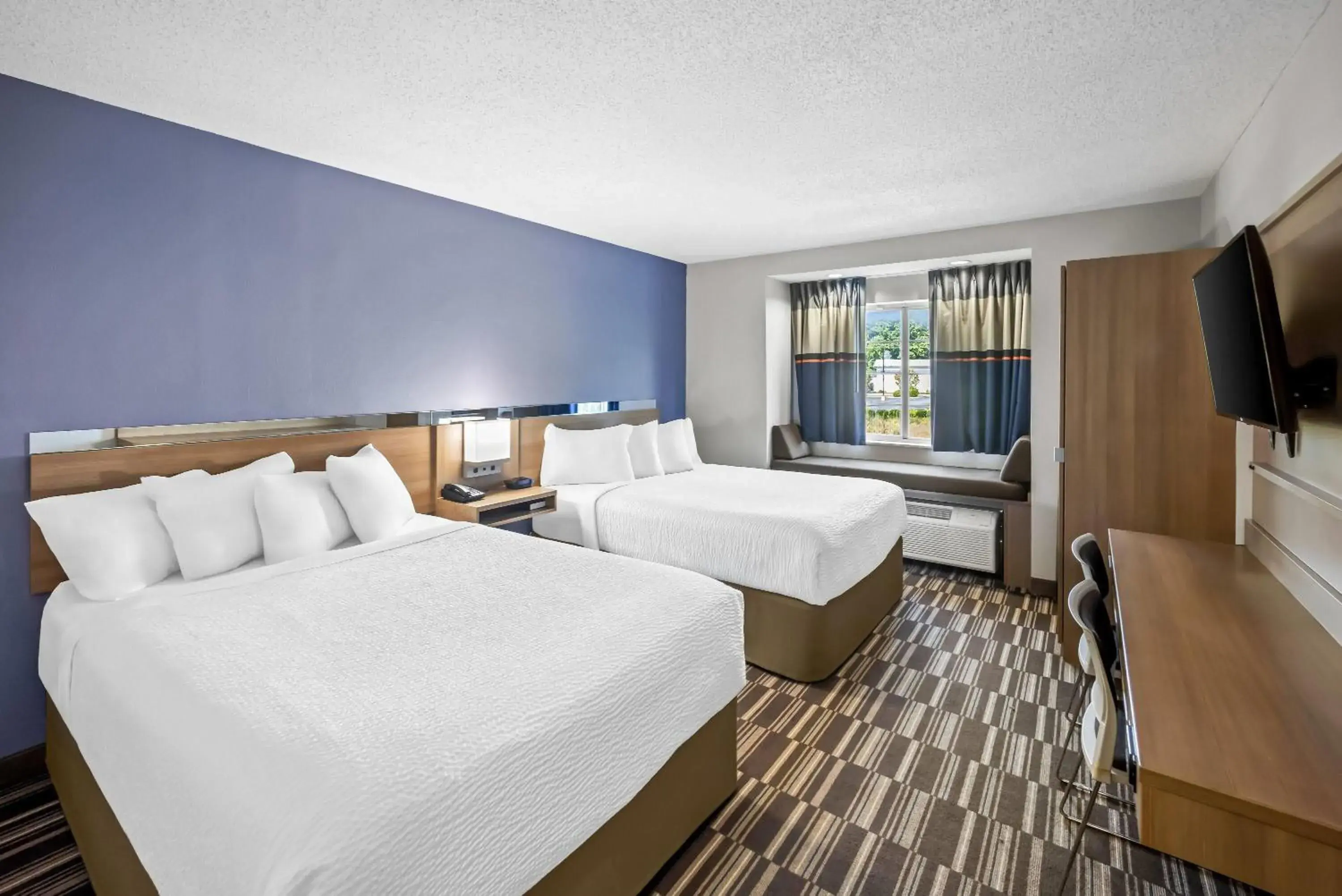 Bed in Microtel Inn by Wyndham Greensboro Bed in Microtel Inn by Wyndham Greensboro