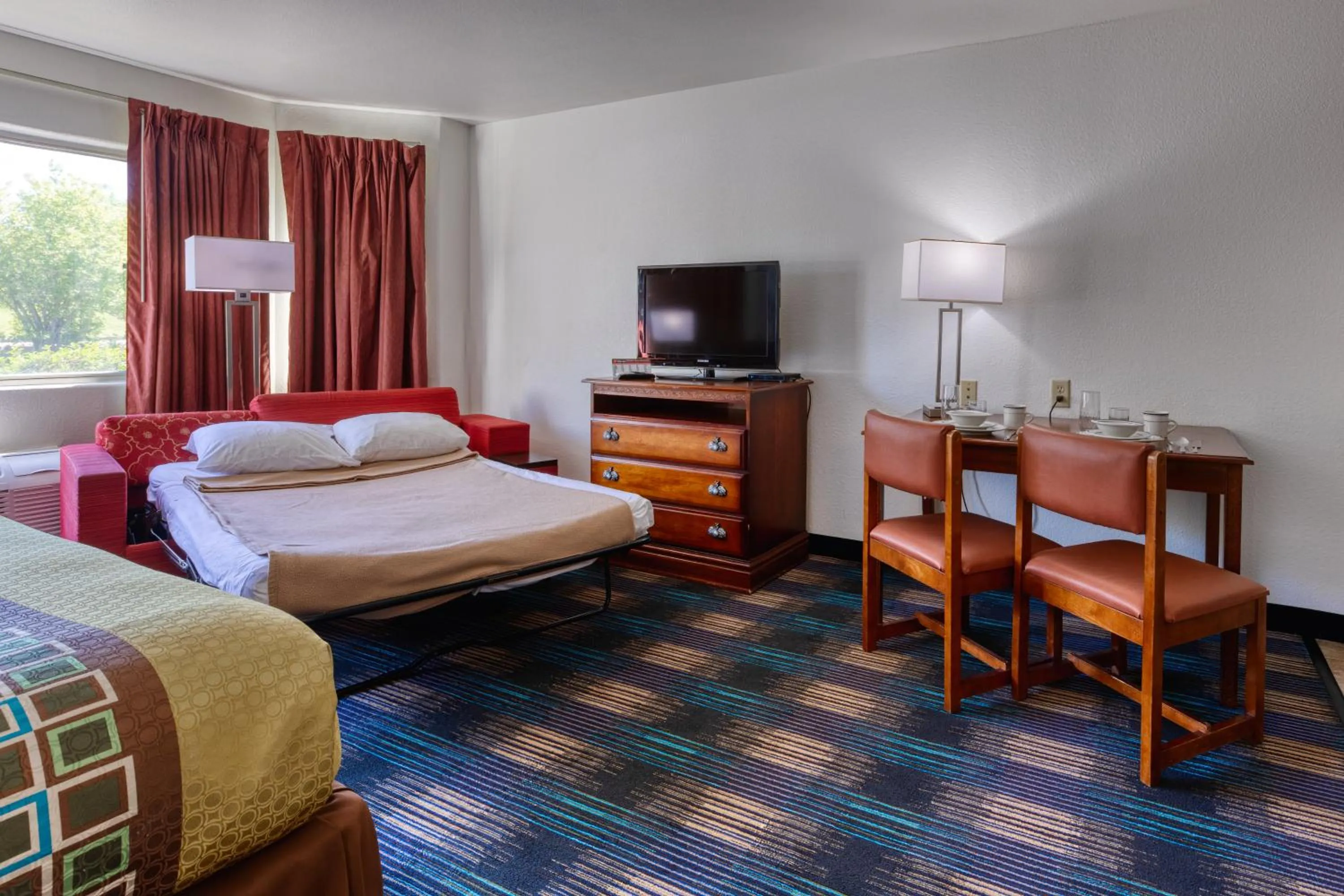 Bed in All Towne Suites