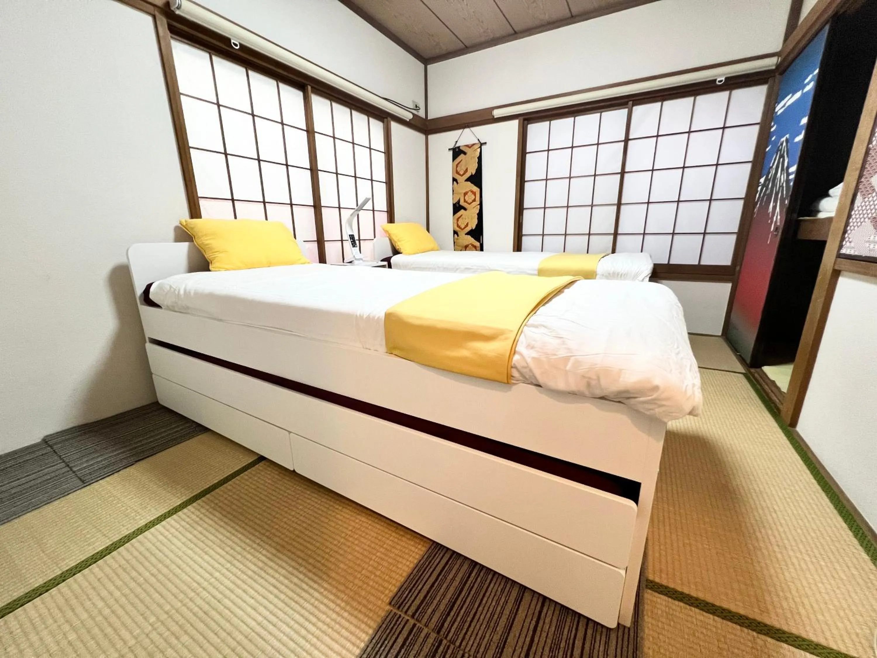 Bed in Ikebukuro no Yado detached house