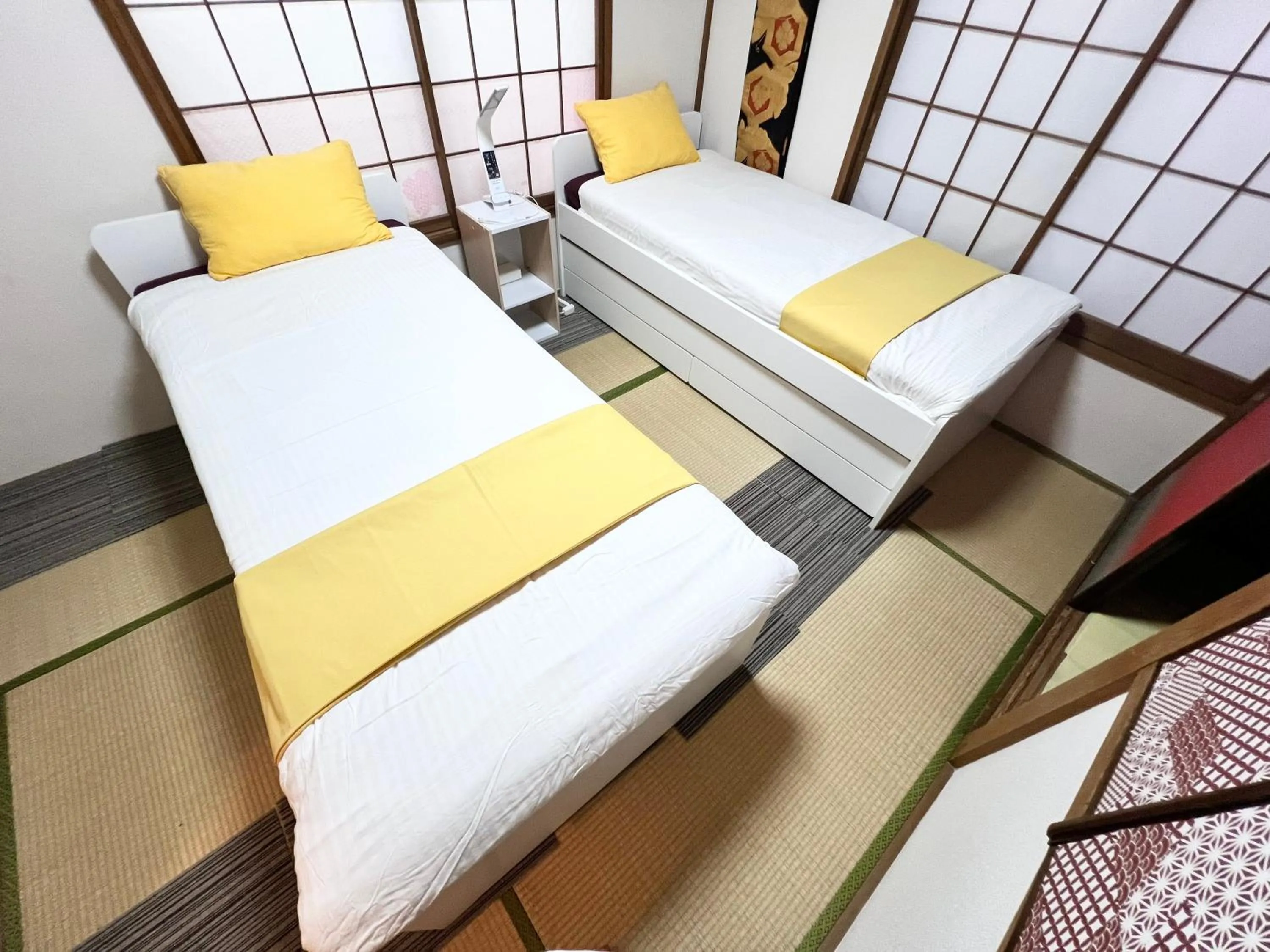 Bed in Ikebukuro no Yado detached house