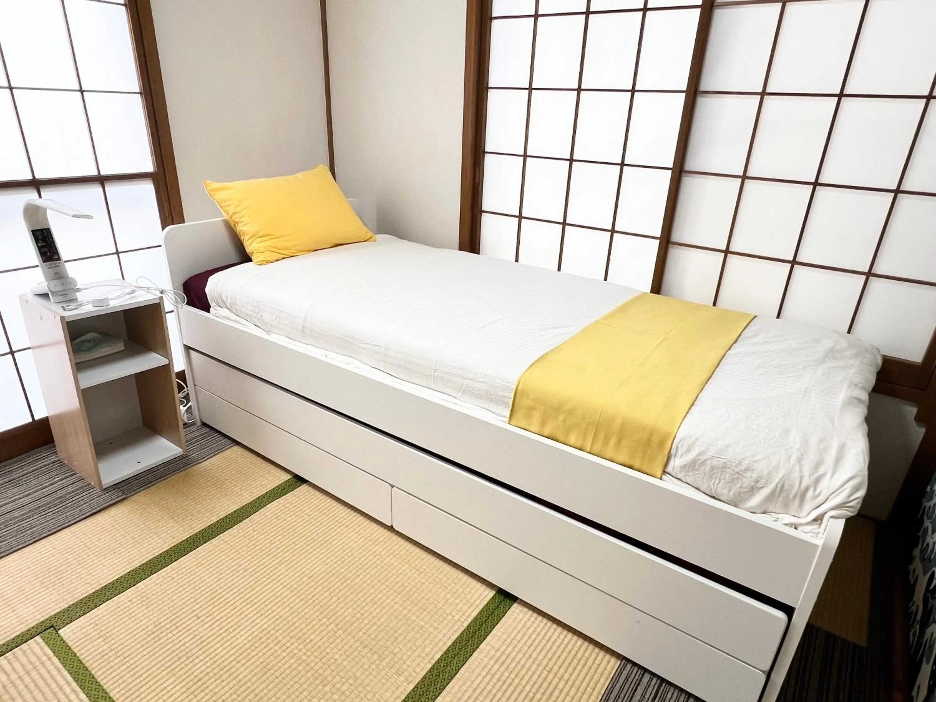 Bed in Ikebukuro no Yado detached house