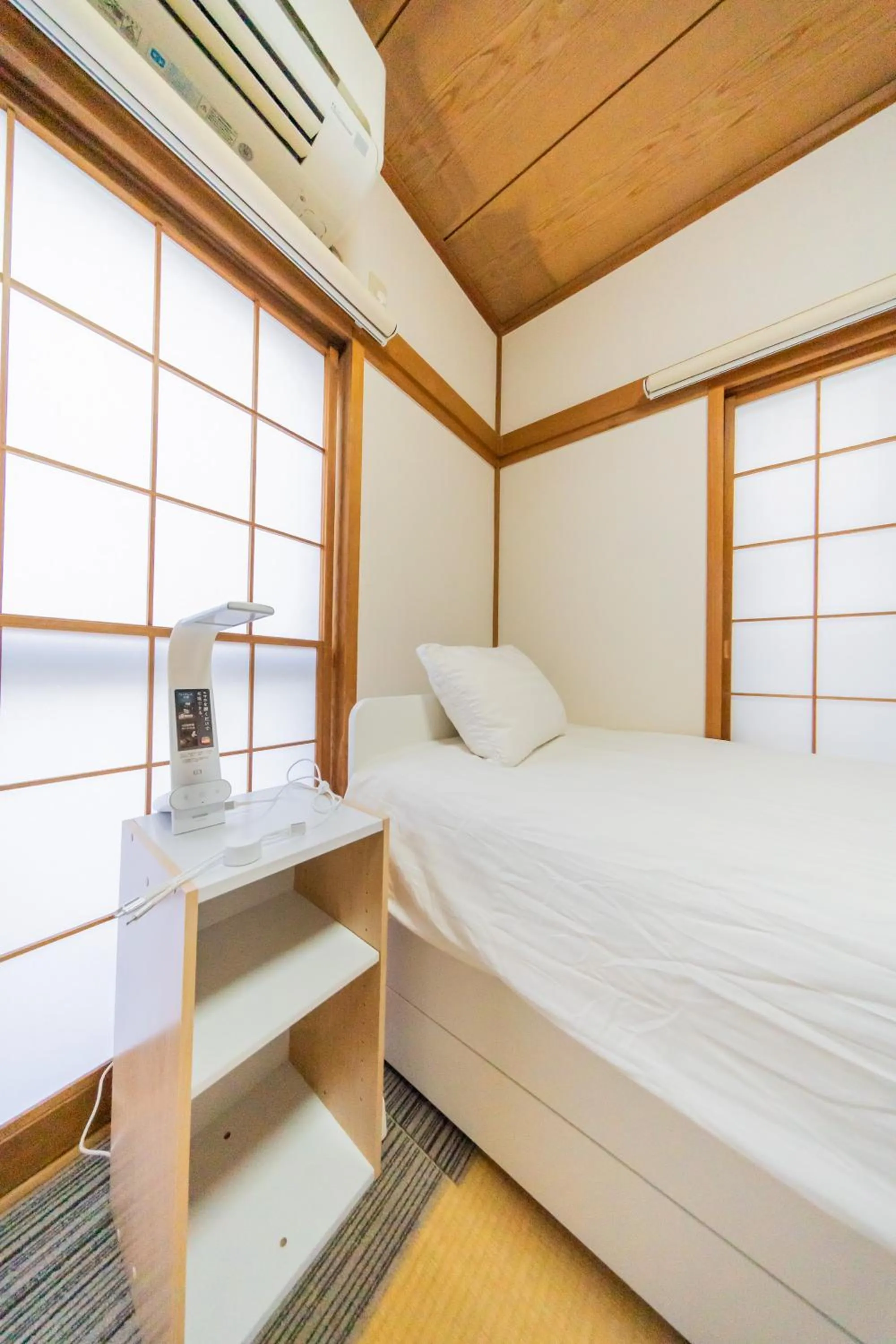 Bed in Ikebukuro no Yado detached house