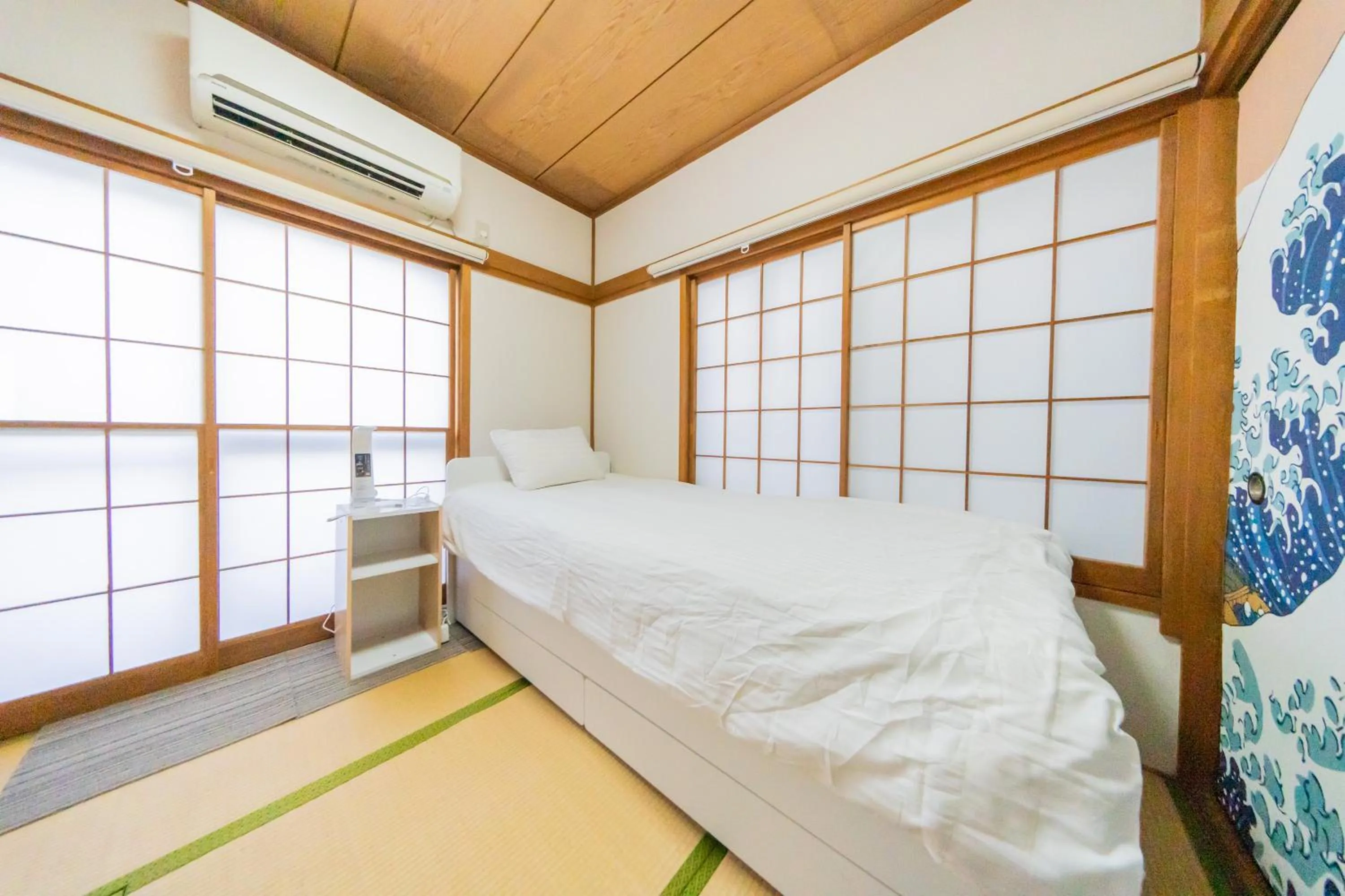 Bed in Ikebukuro no Yado detached house