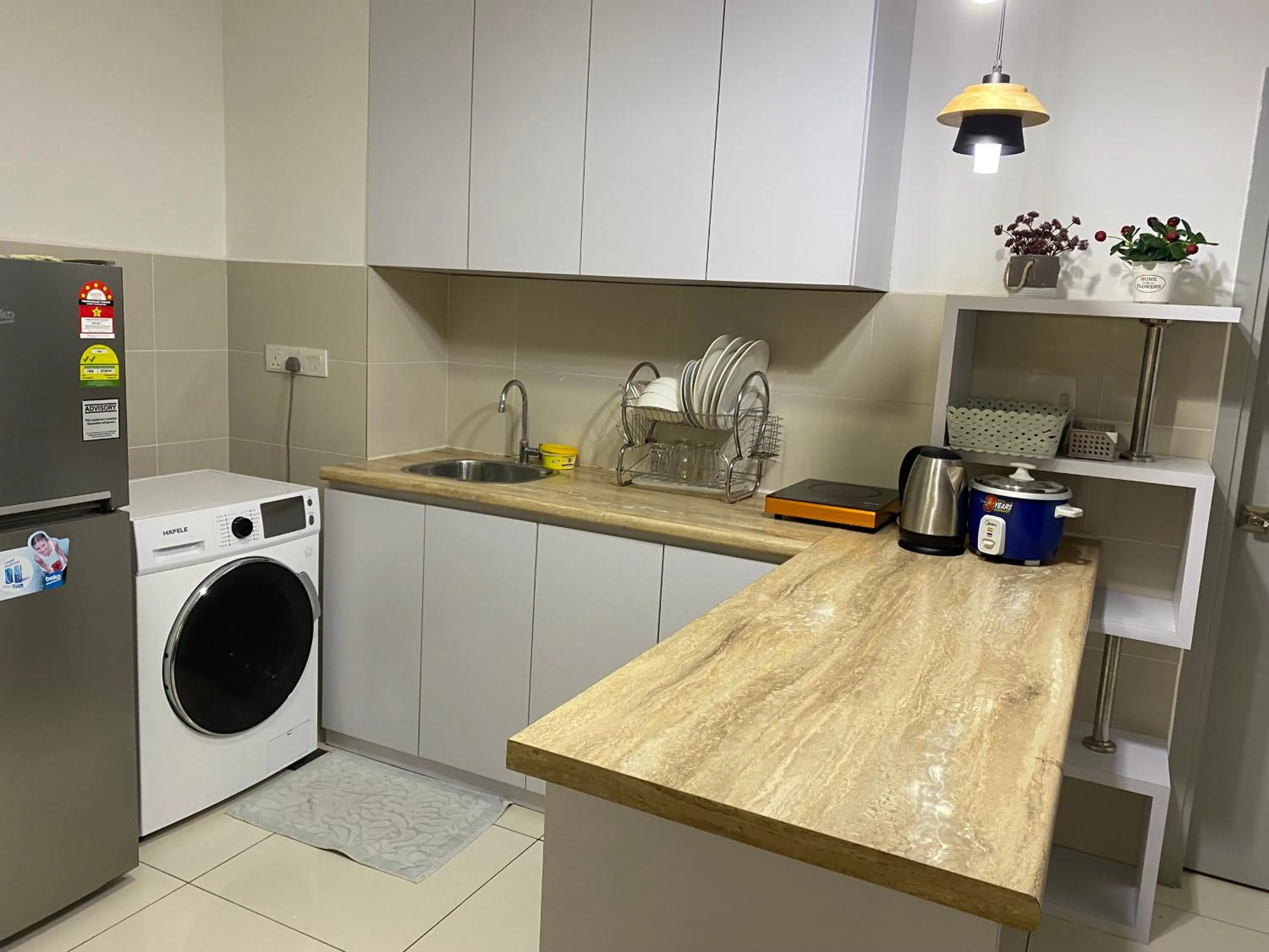 Kitchen or kitchenette in Sutera Avenue by Alawa Homes Kota Kinabalu