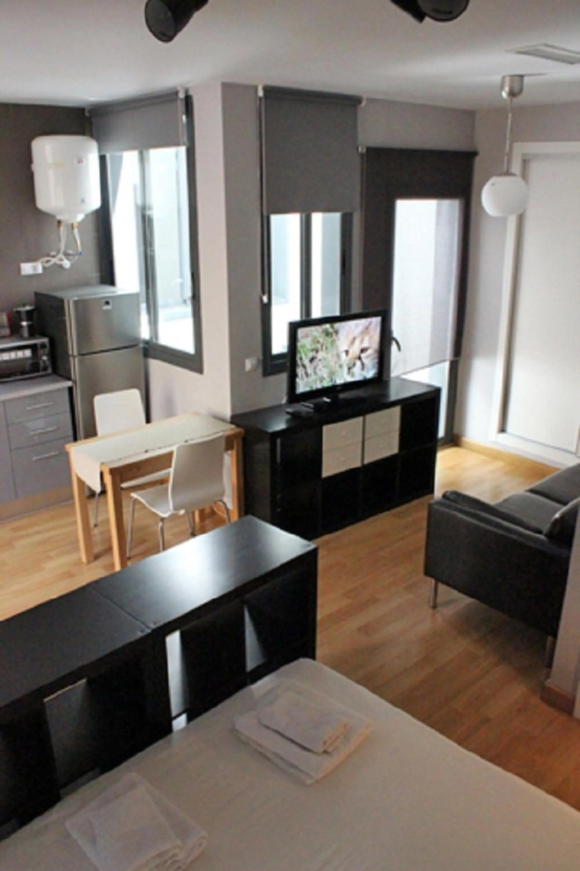 Living room, Bed in Apartamentos San Pablo