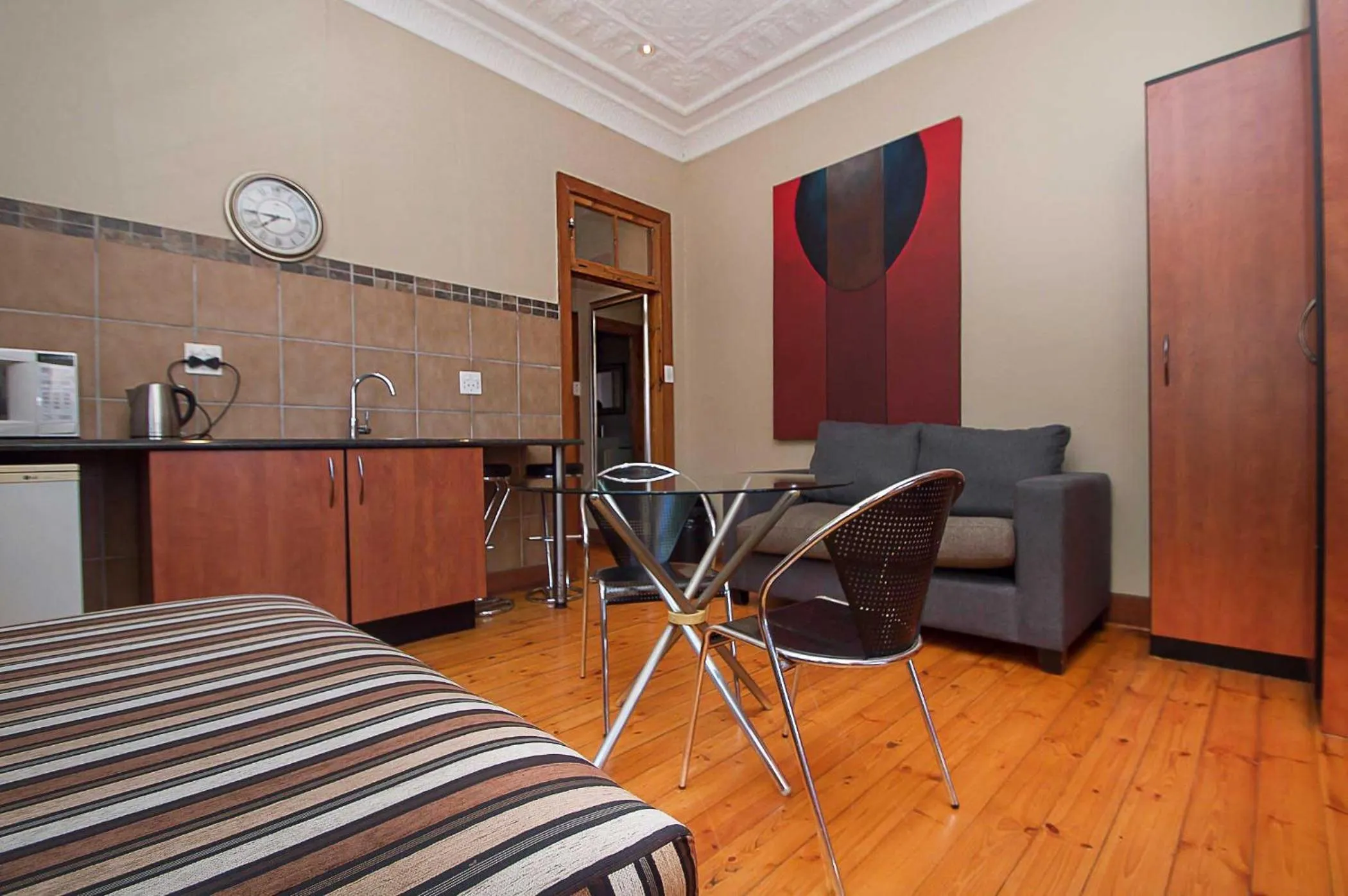 Seating area, Bed in Saffron Guest House