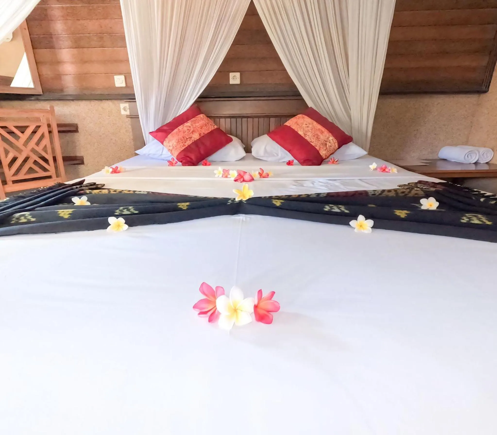 Bed in Suka Sari Cottages