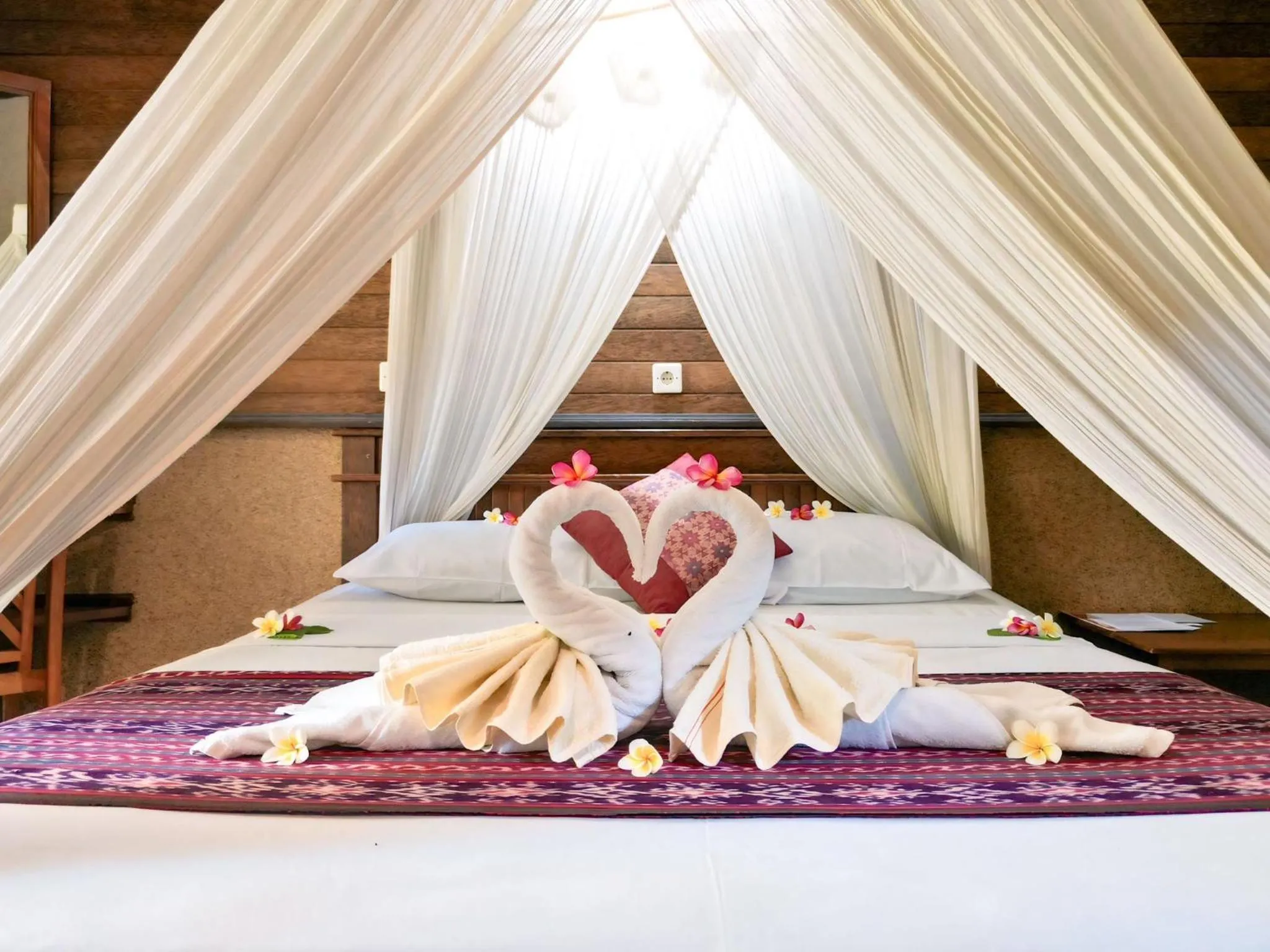 Bed in Suka Sari Cottages