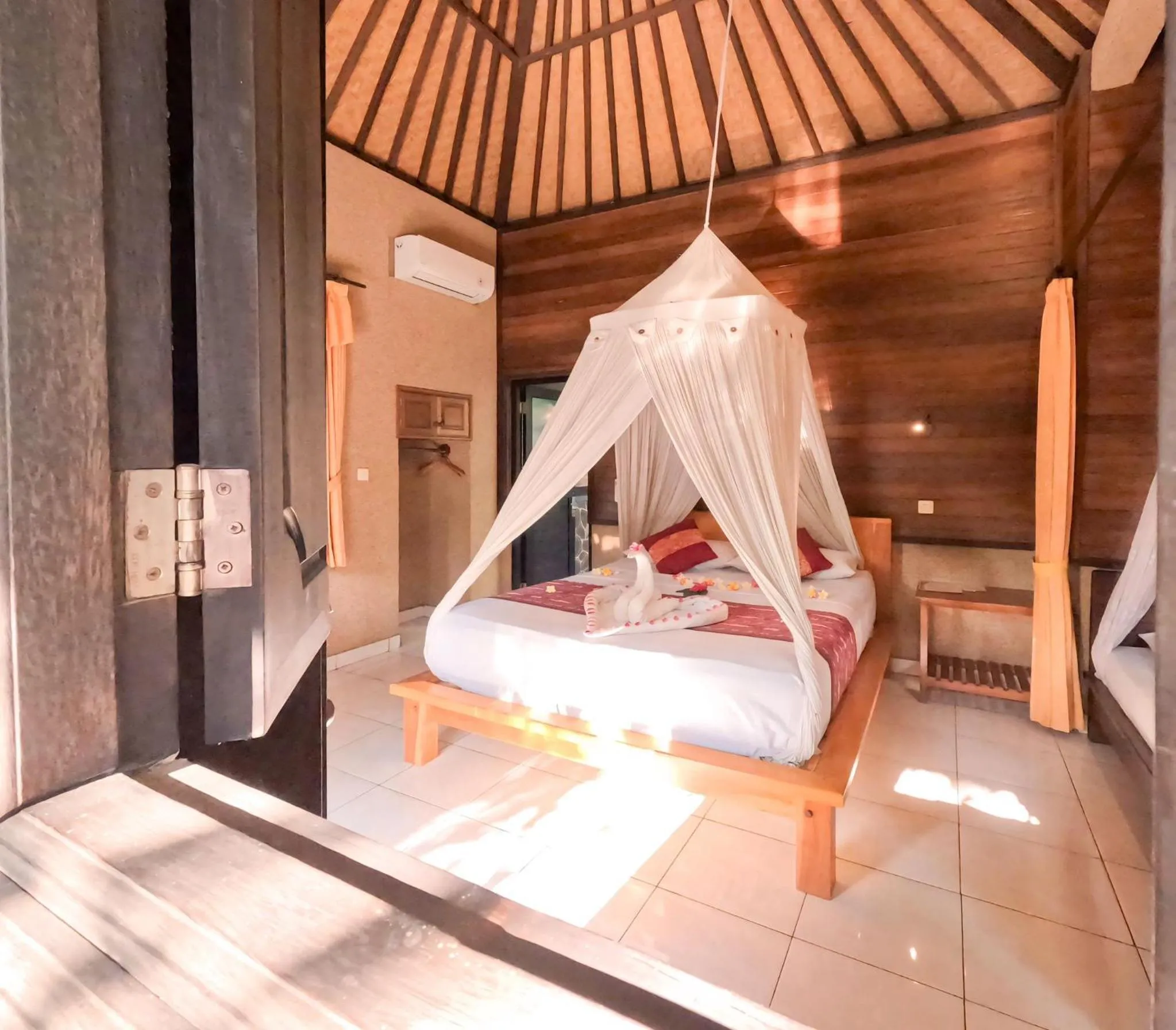 Bed in Suka Sari Cottages