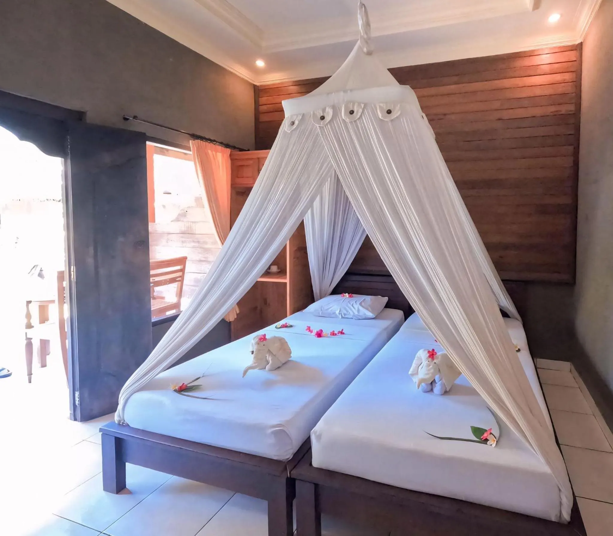 Bed in Suka Sari Cottages