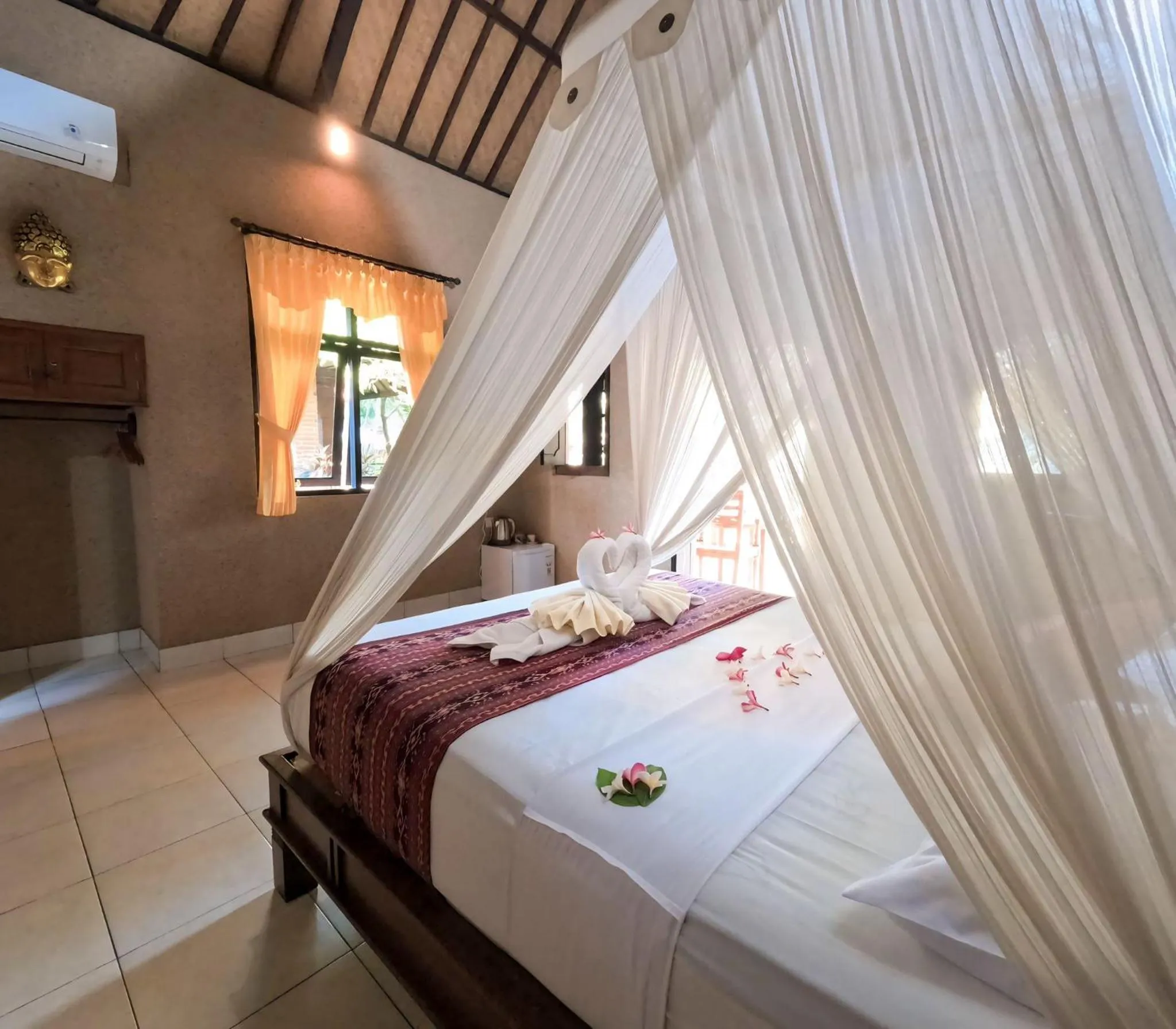 Bed in Suka Sari Cottages