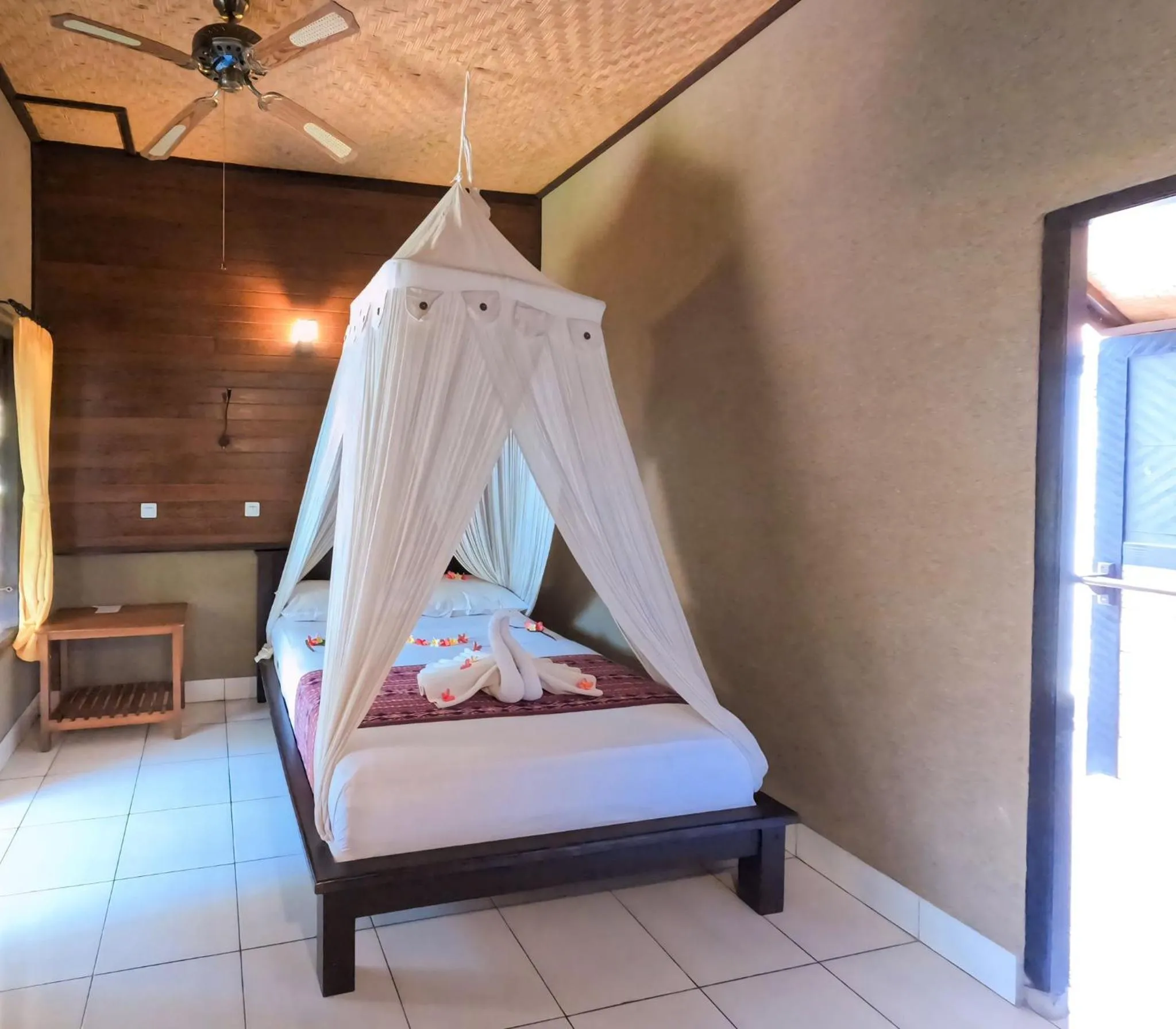 Bed in Suka Sari Cottages