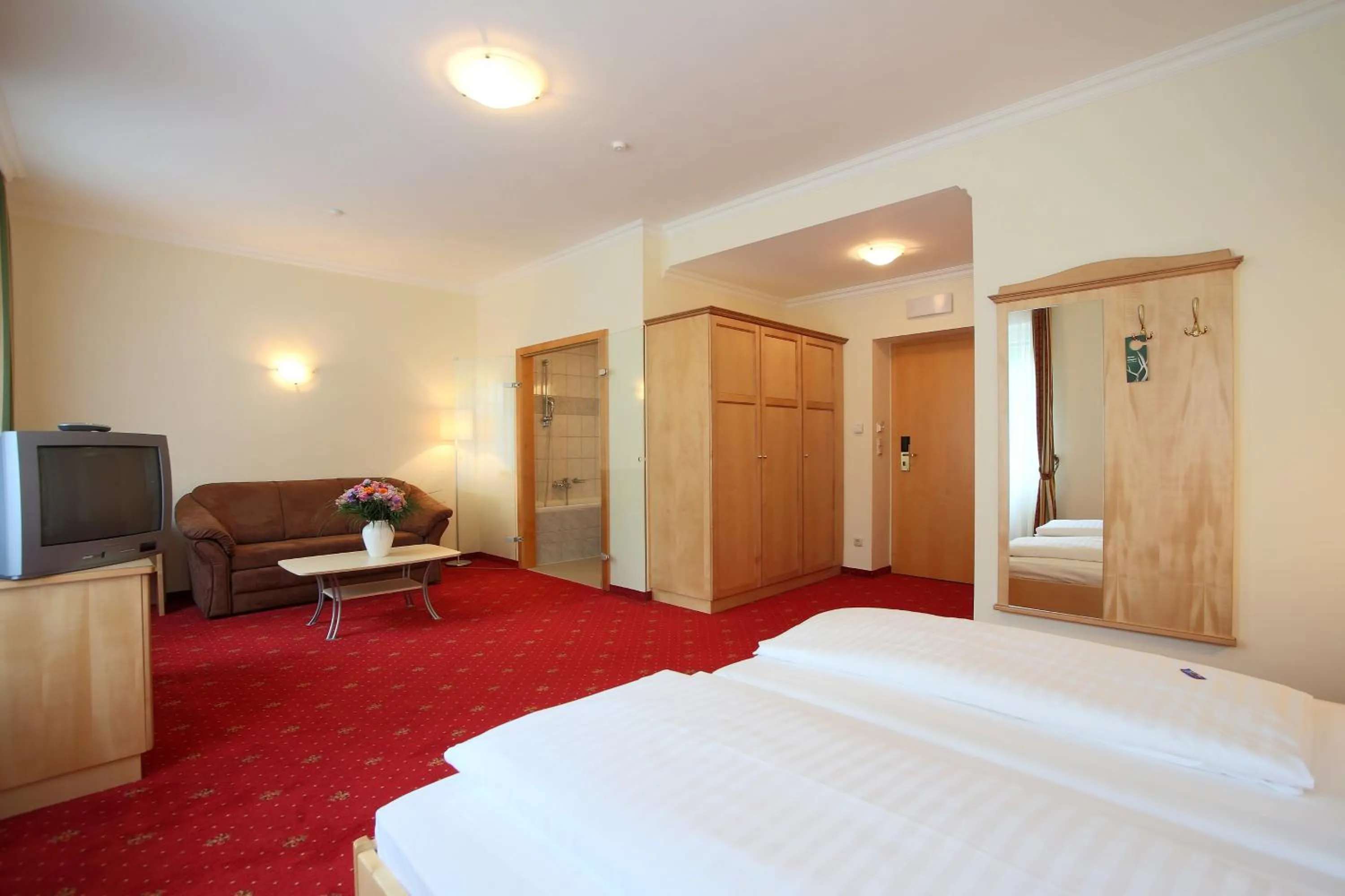 Bed in AKTIVHOTEL Weisser Hirsch