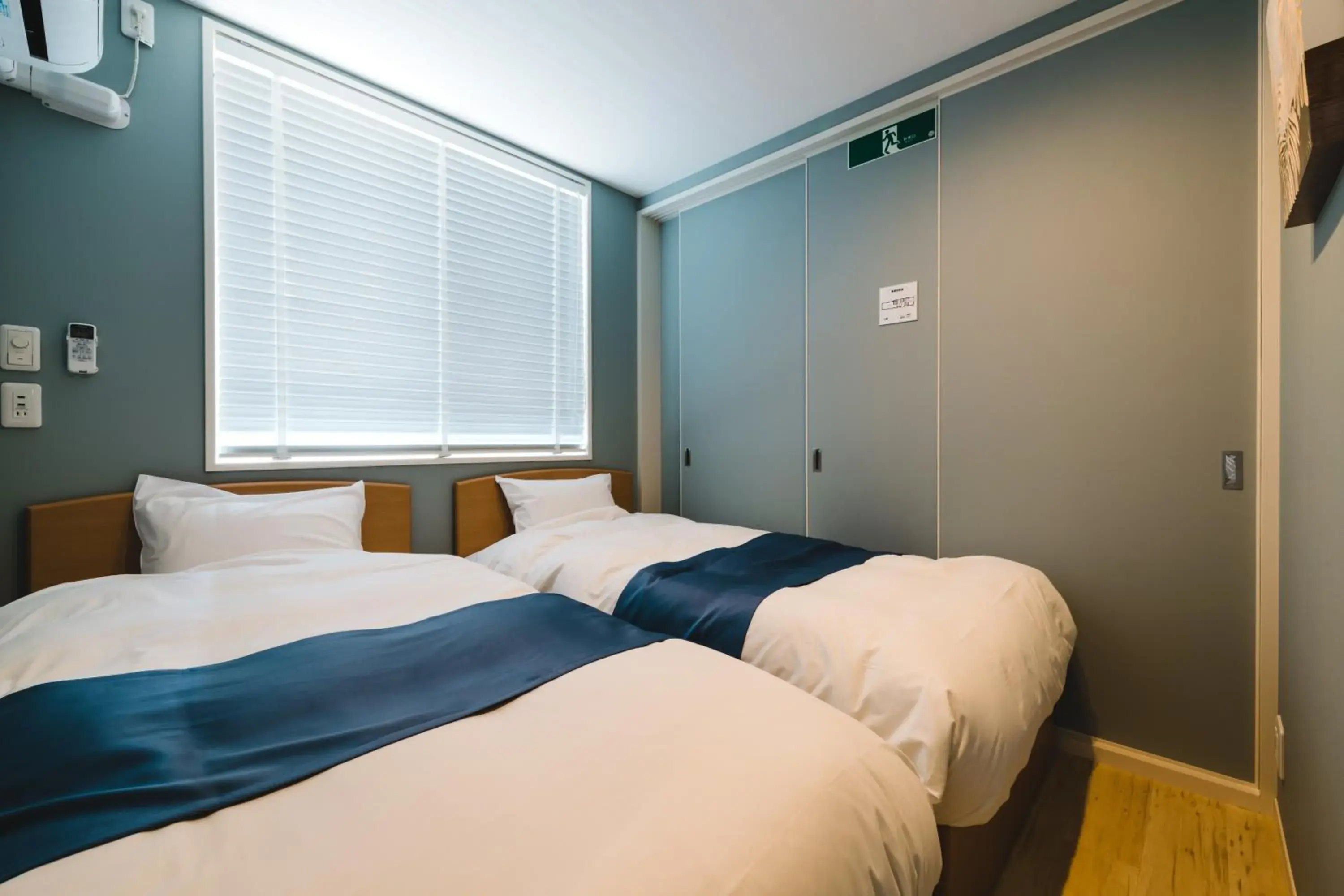 Bedroom, Bed in Trip Base HAKATAEKIMAE Bedroom, Bed in Trip Base HAKATAEKIMAE