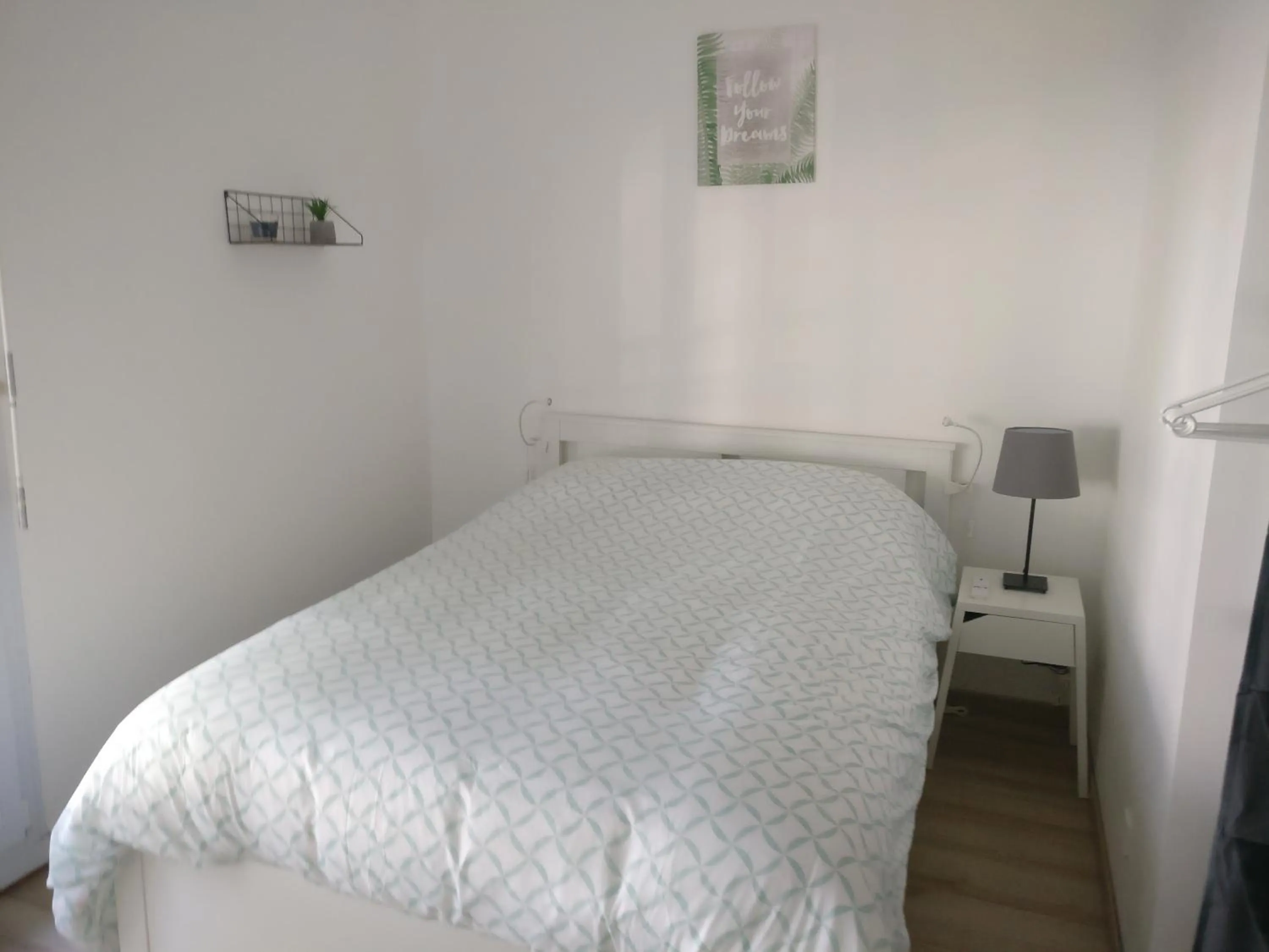 Bed in Appart Hôtel L'Angélique