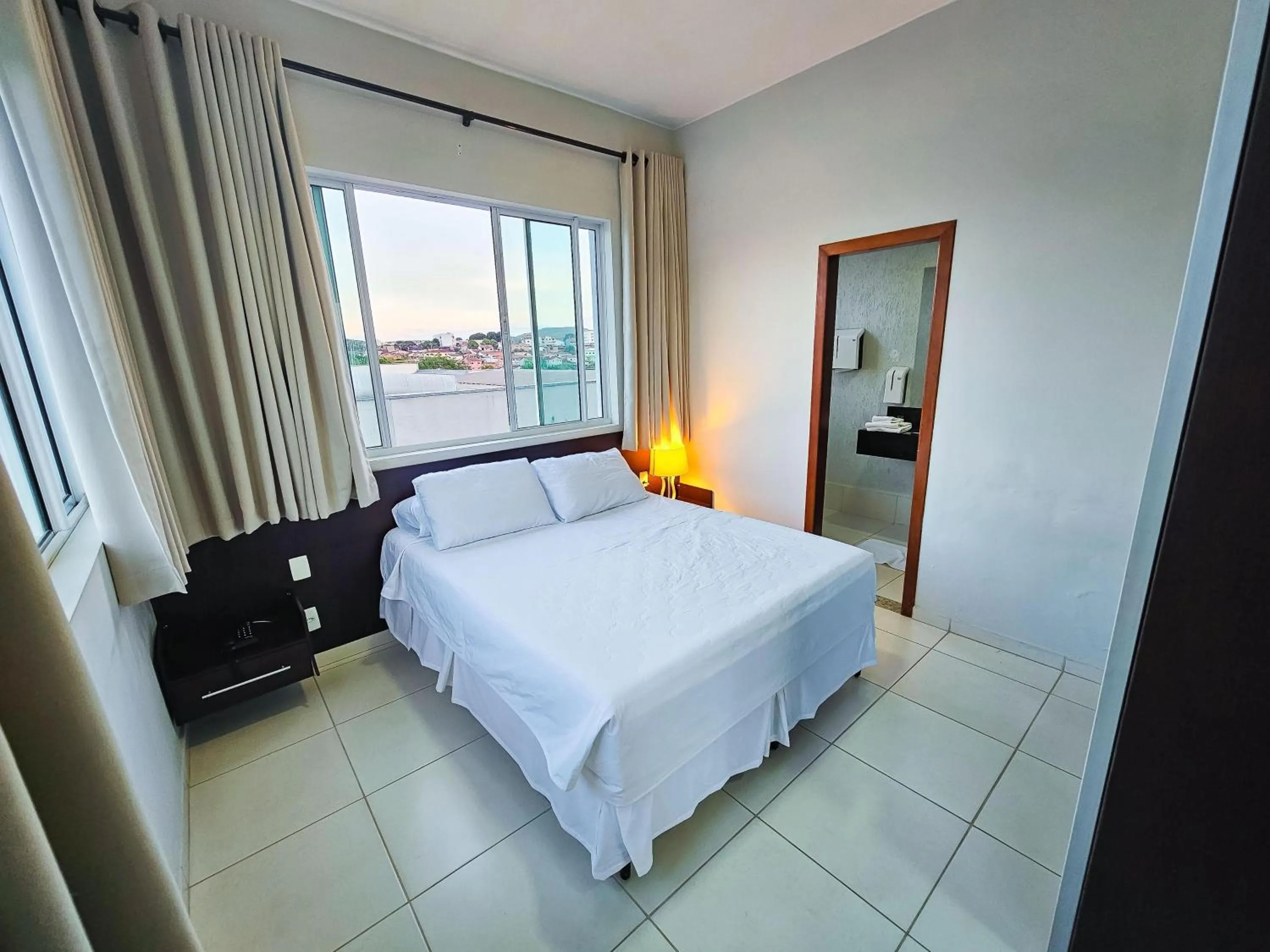 Bed in Paracatu Plaza Hotel