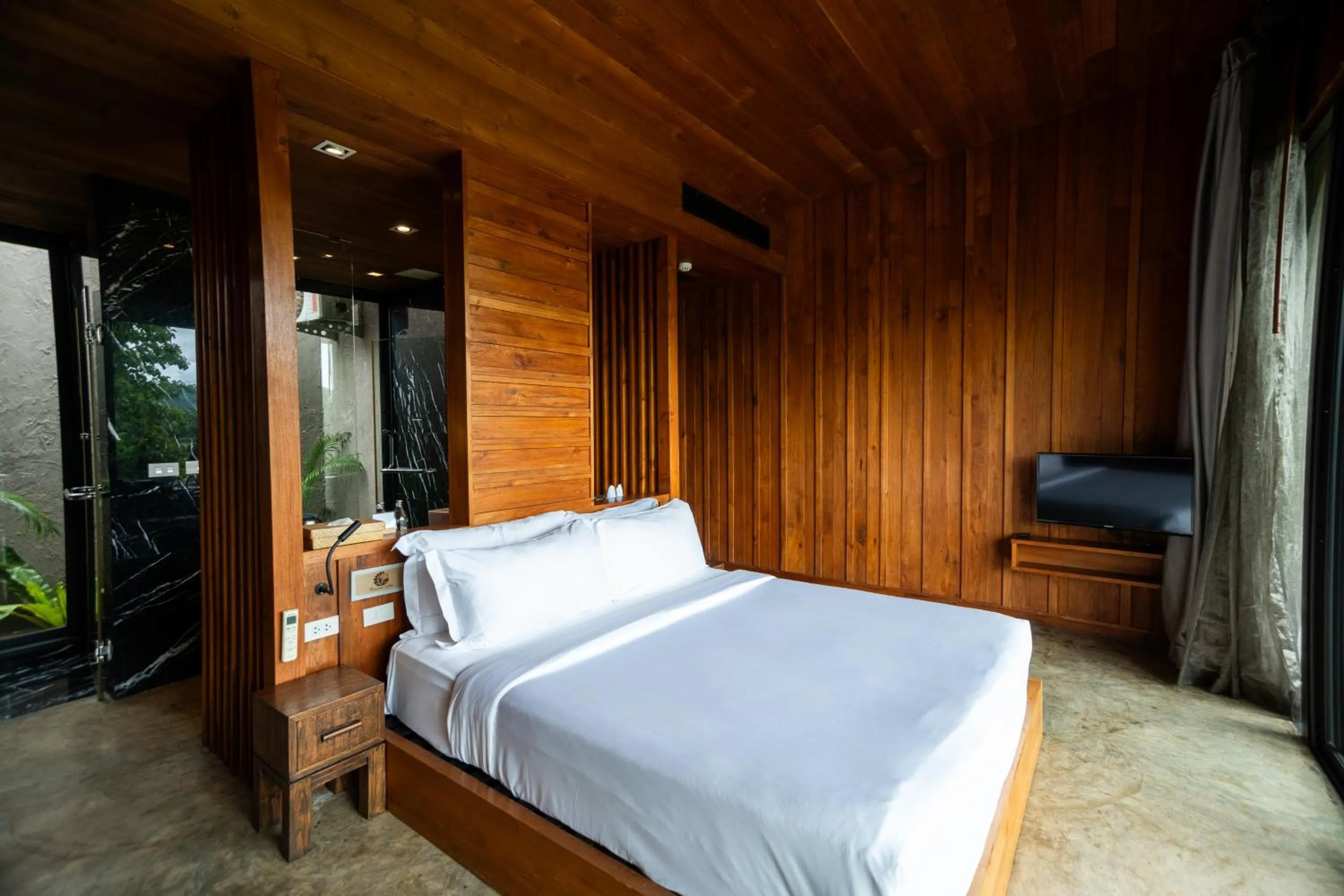 Bed in Puripai Villa