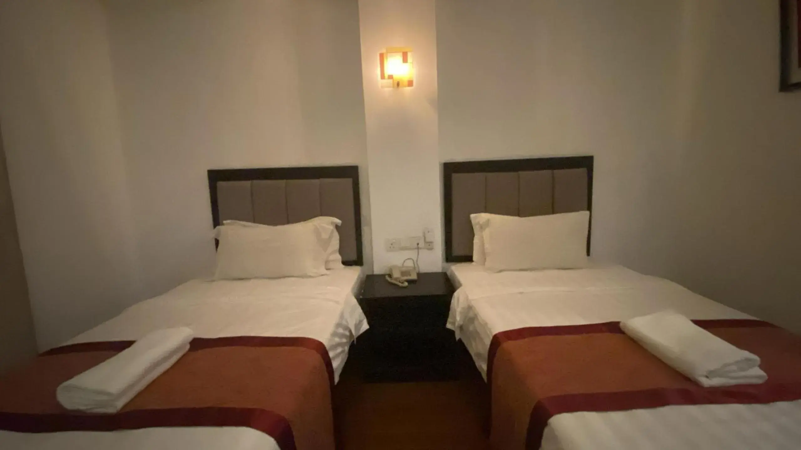 Bed in KK Waterfront Hotel Bed in KK Waterfront Hotel