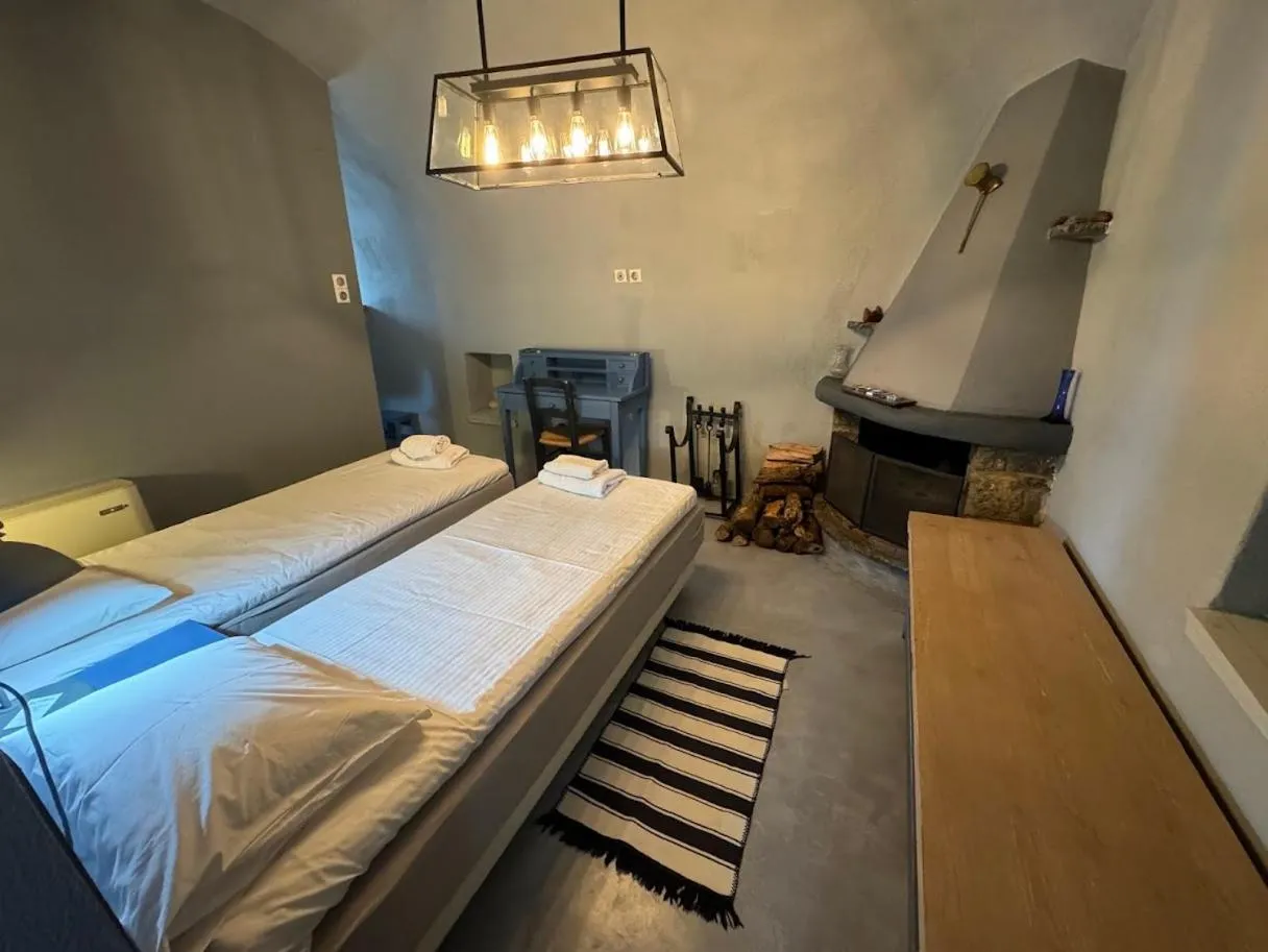 Photo of the whole room, Bed in Avgonima Chios Spitakia Cottages