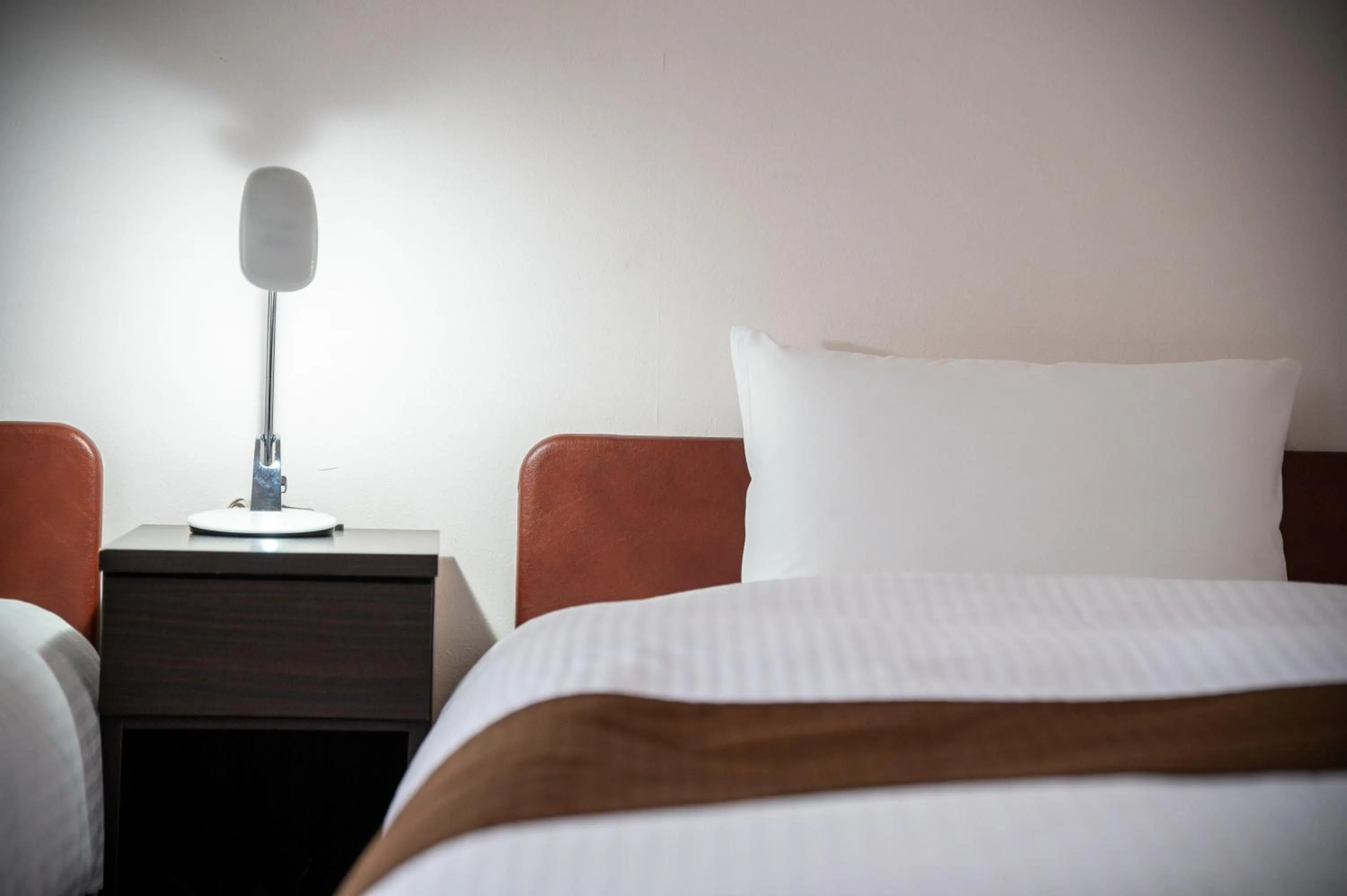 Bed in Kagoshima Daiichi Hotel Kamoike