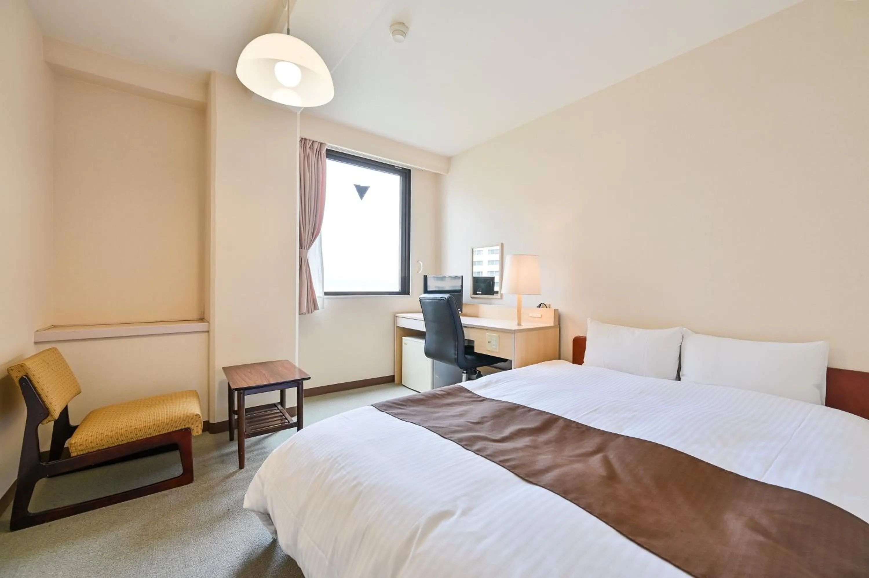 Bed in Kagoshima Daiichi Hotel Kamoike