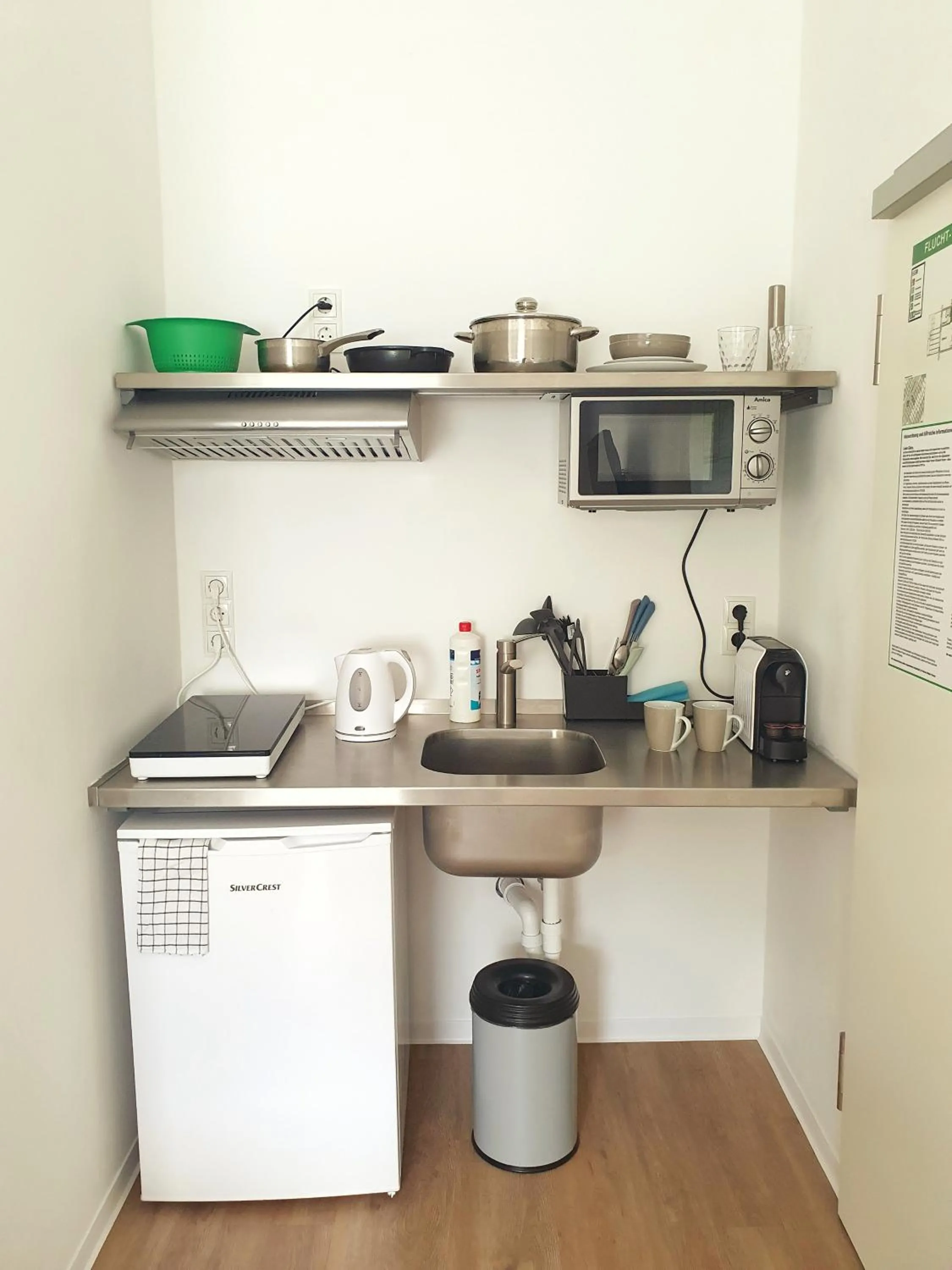 Kitchen or kitchenette in Aparthotel Sanni