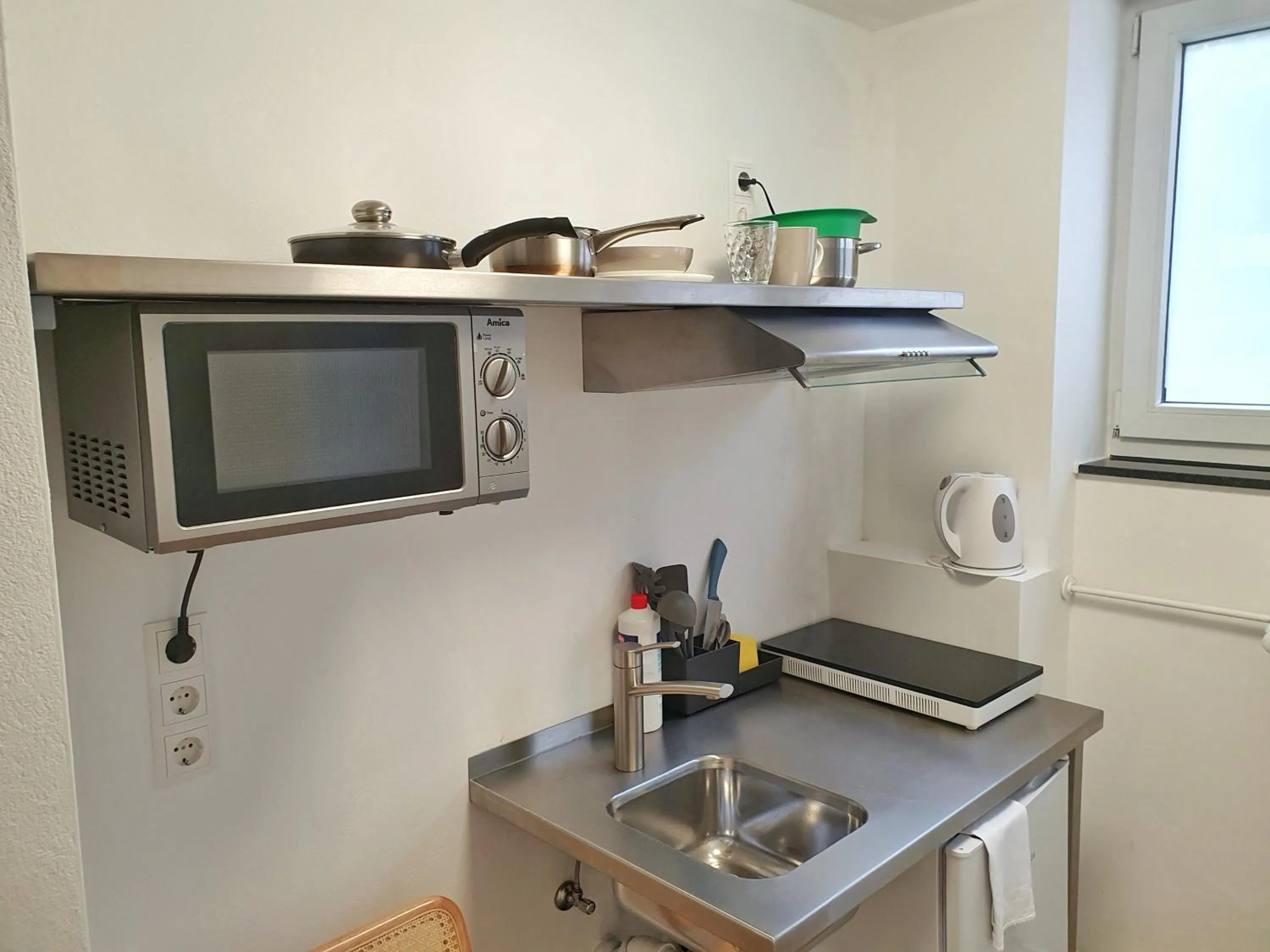 Kitchen or kitchenette in Aparthotel Sanni
