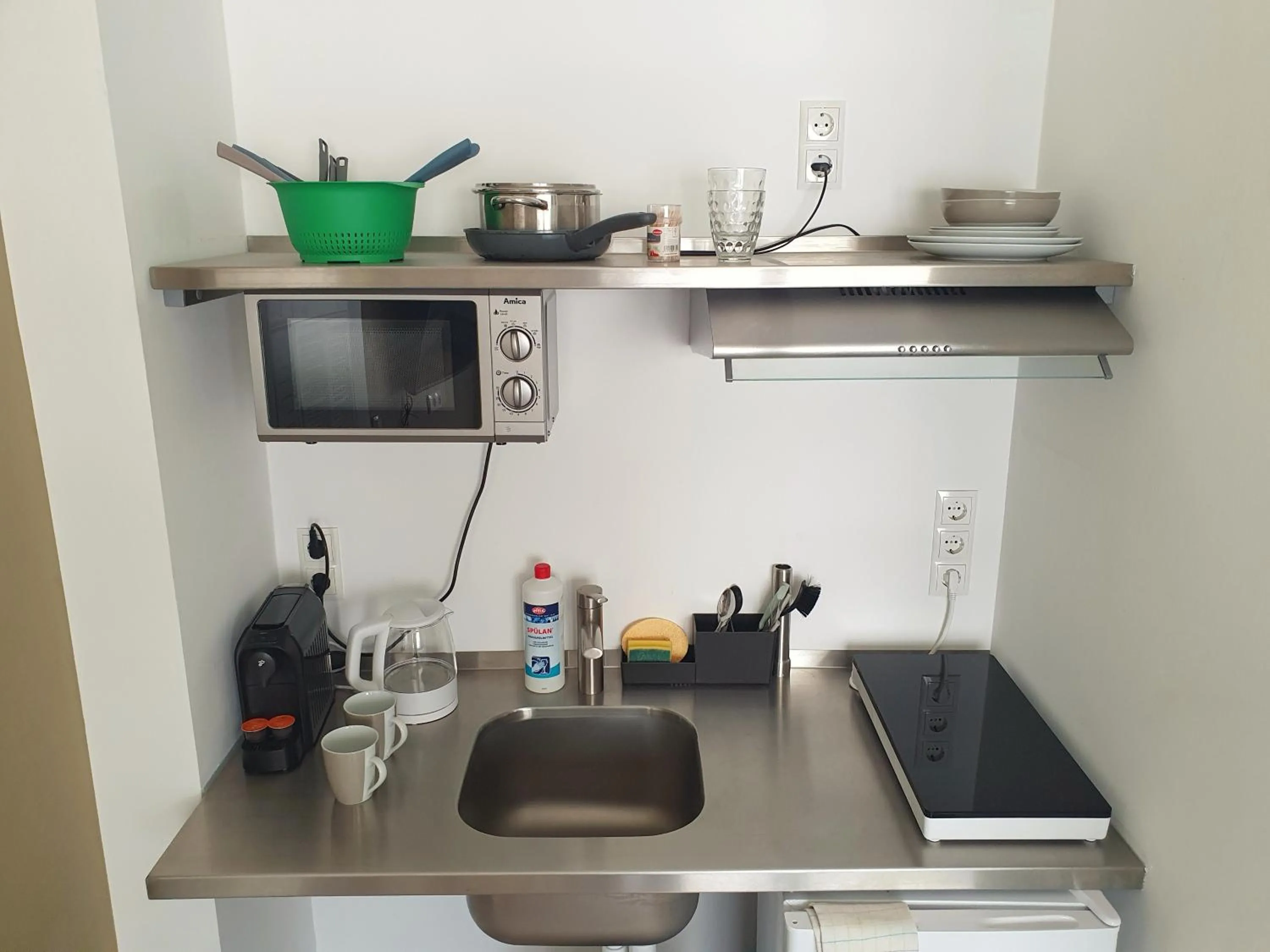 Kitchen or kitchenette in Aparthotel Sanni