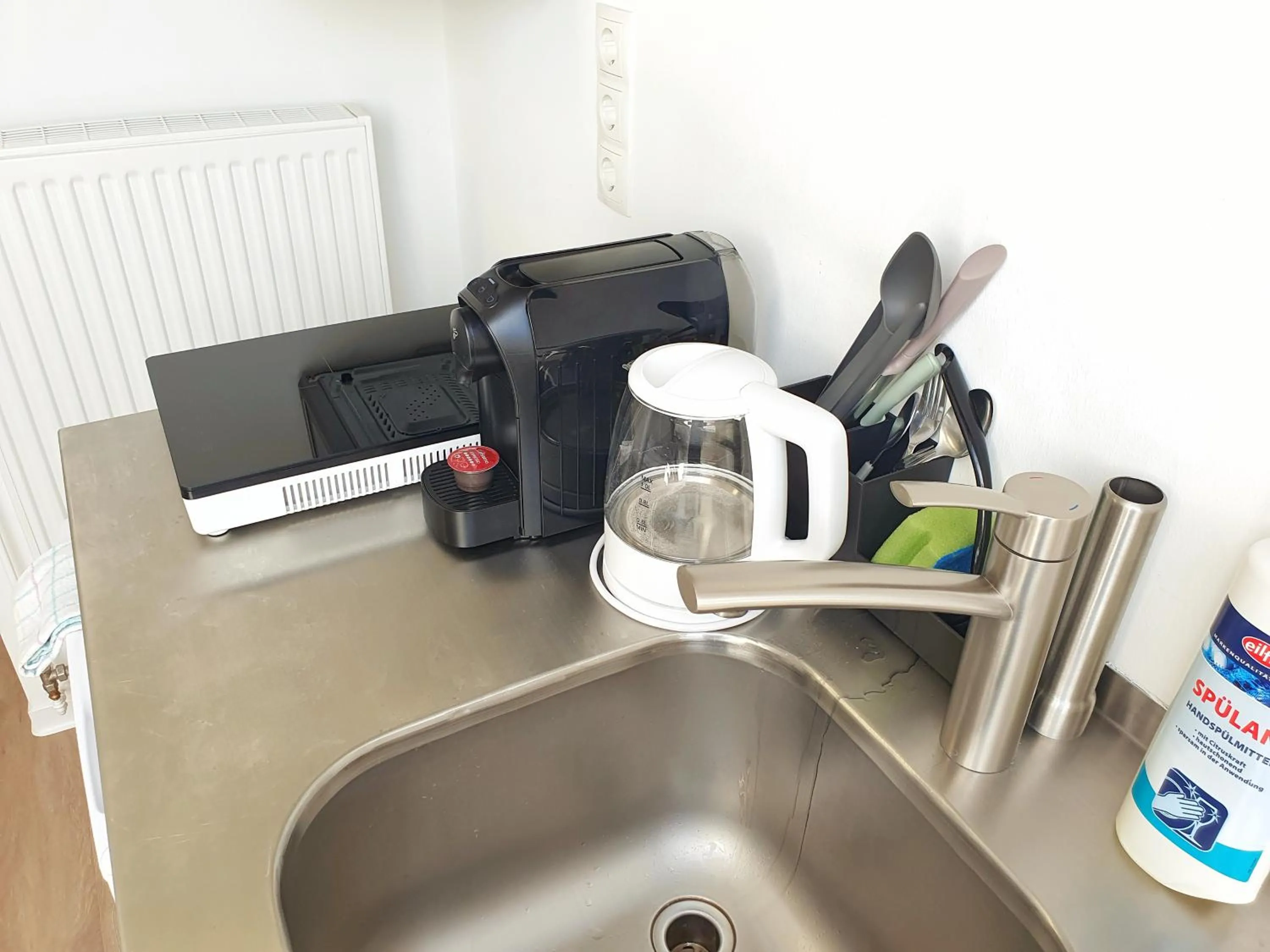 Kitchen or kitchenette in Aparthotel Sanni