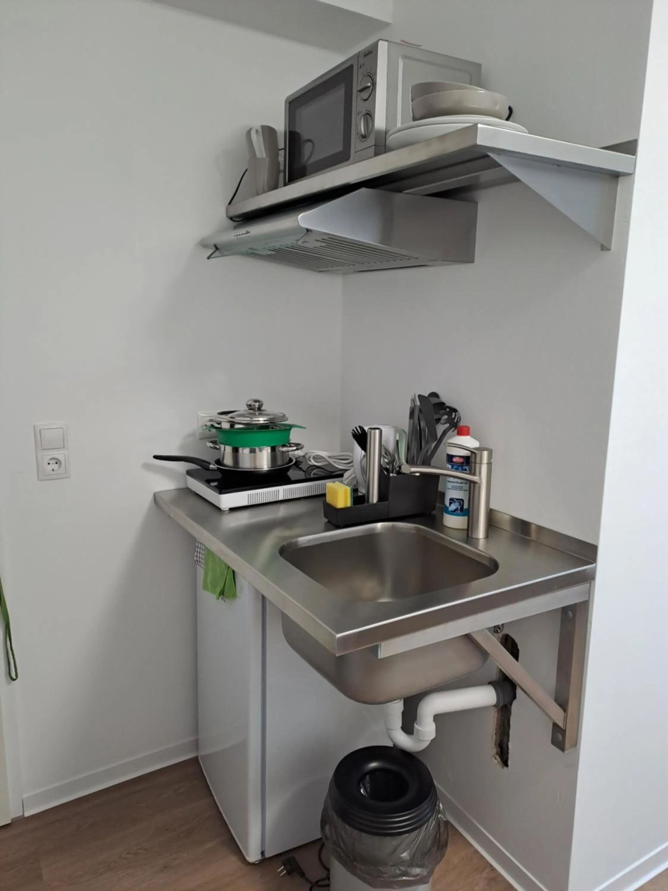 Kitchen or kitchenette in Aparthotel Sanni