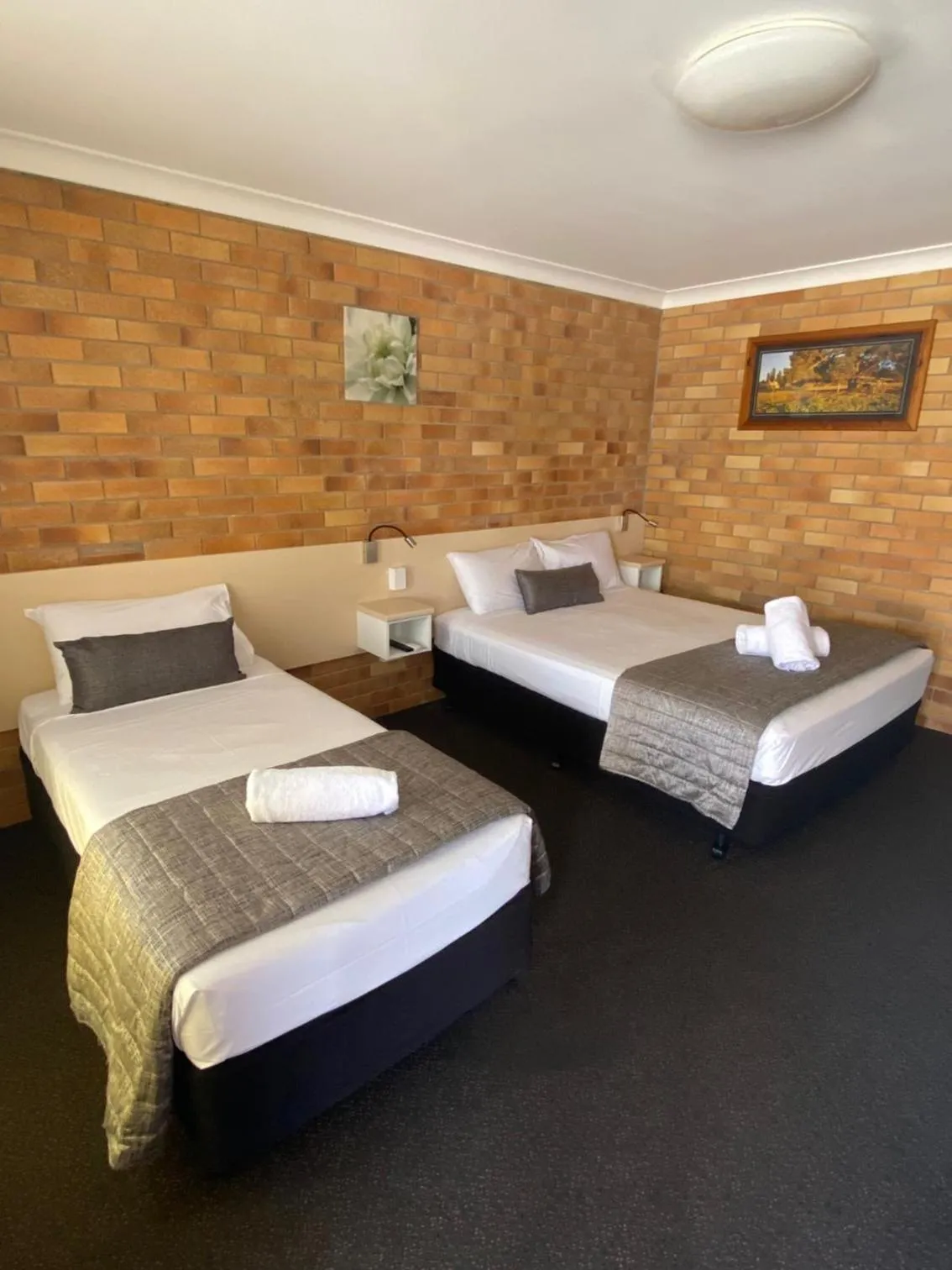 Bed in Buckaroo Motor Inn