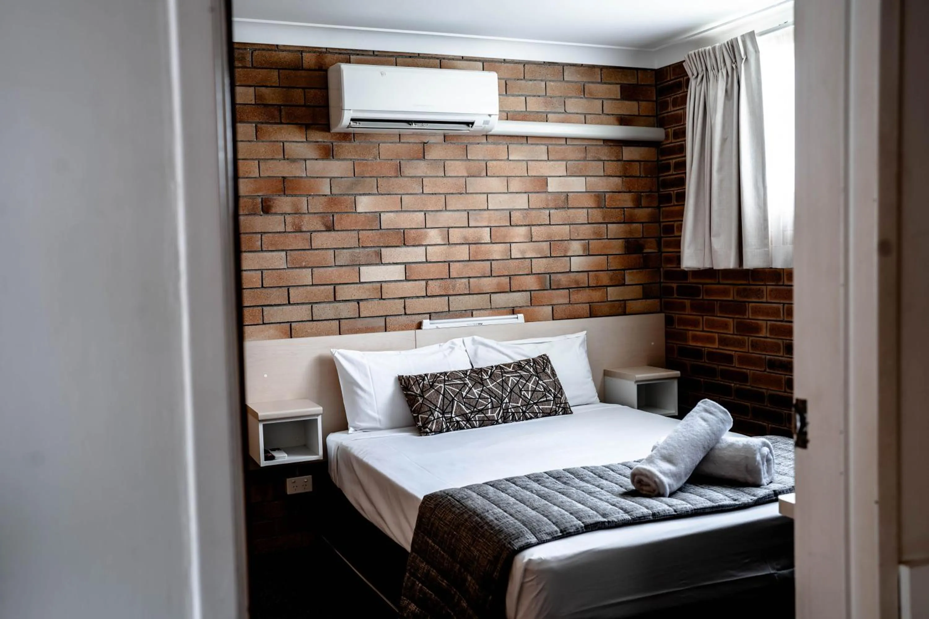 Bed in Buckaroo Motor Inn