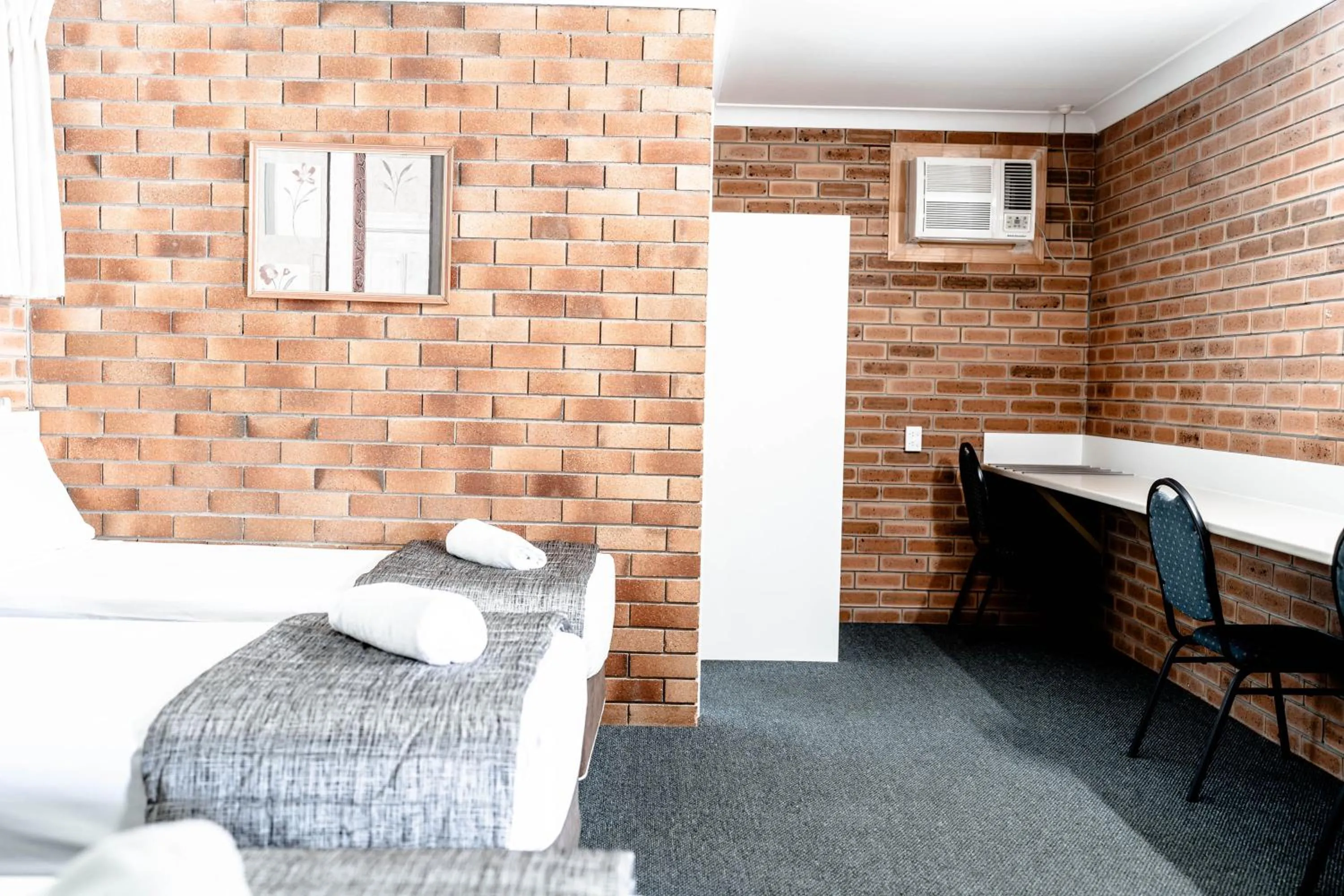 Bed in Buckaroo Motor Inn