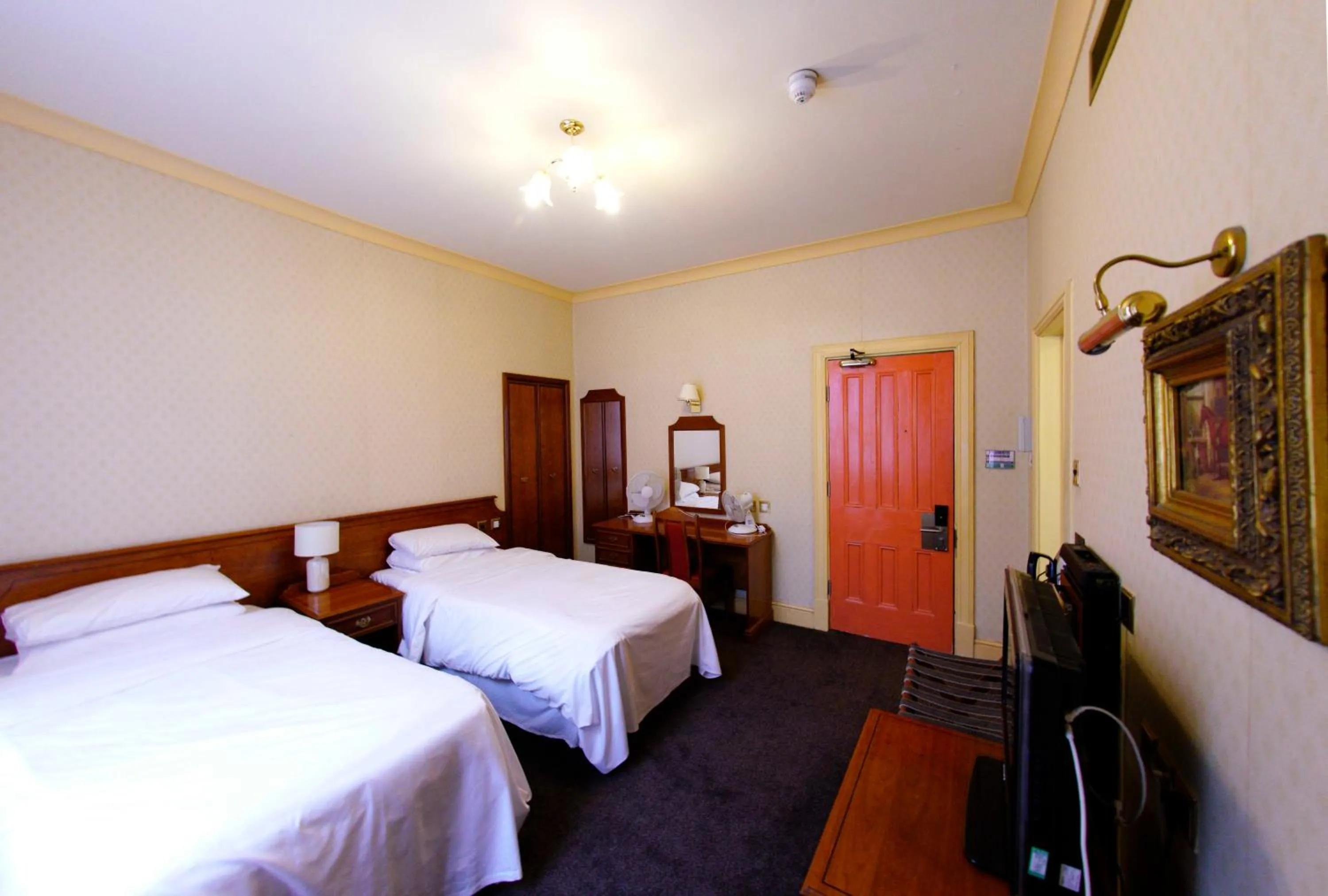 Bed in Three Queens Hotel