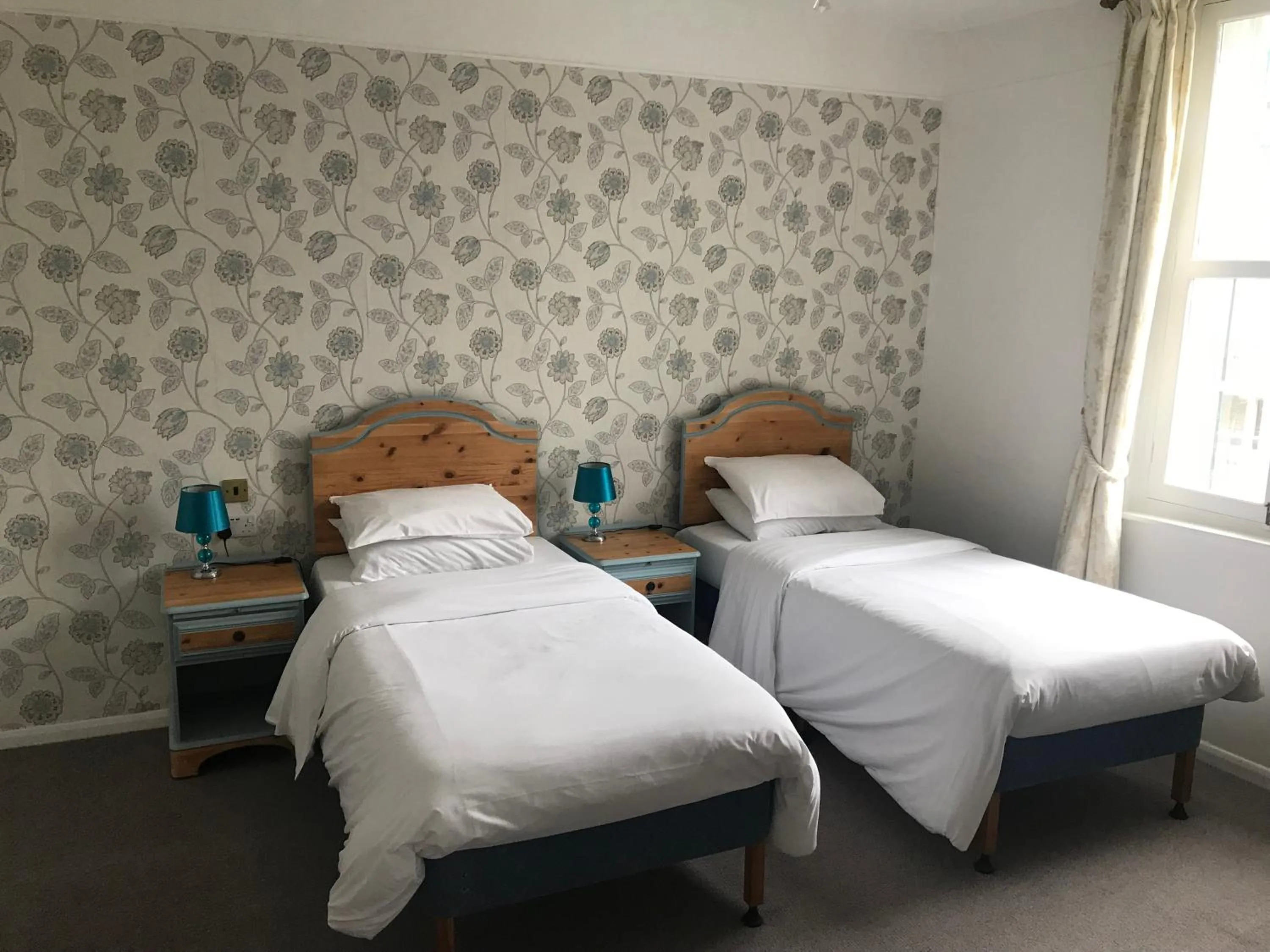 Bed in Three Queens Hotel