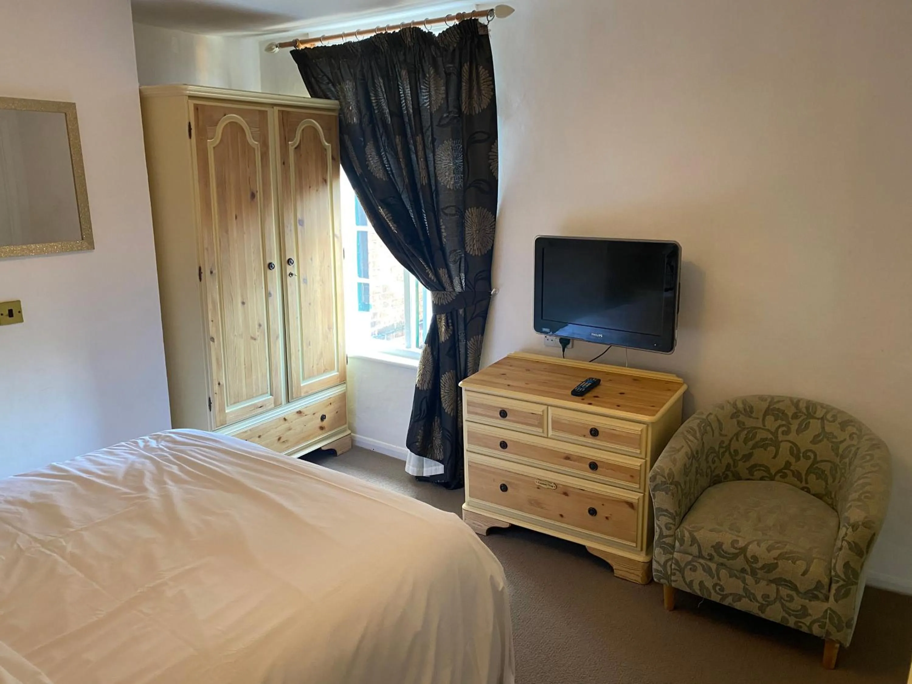 Bed in Three Queens Hotel