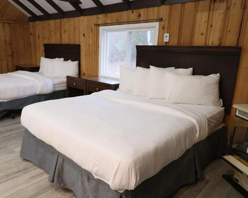 Bed in Algonquin Lakeside Inn