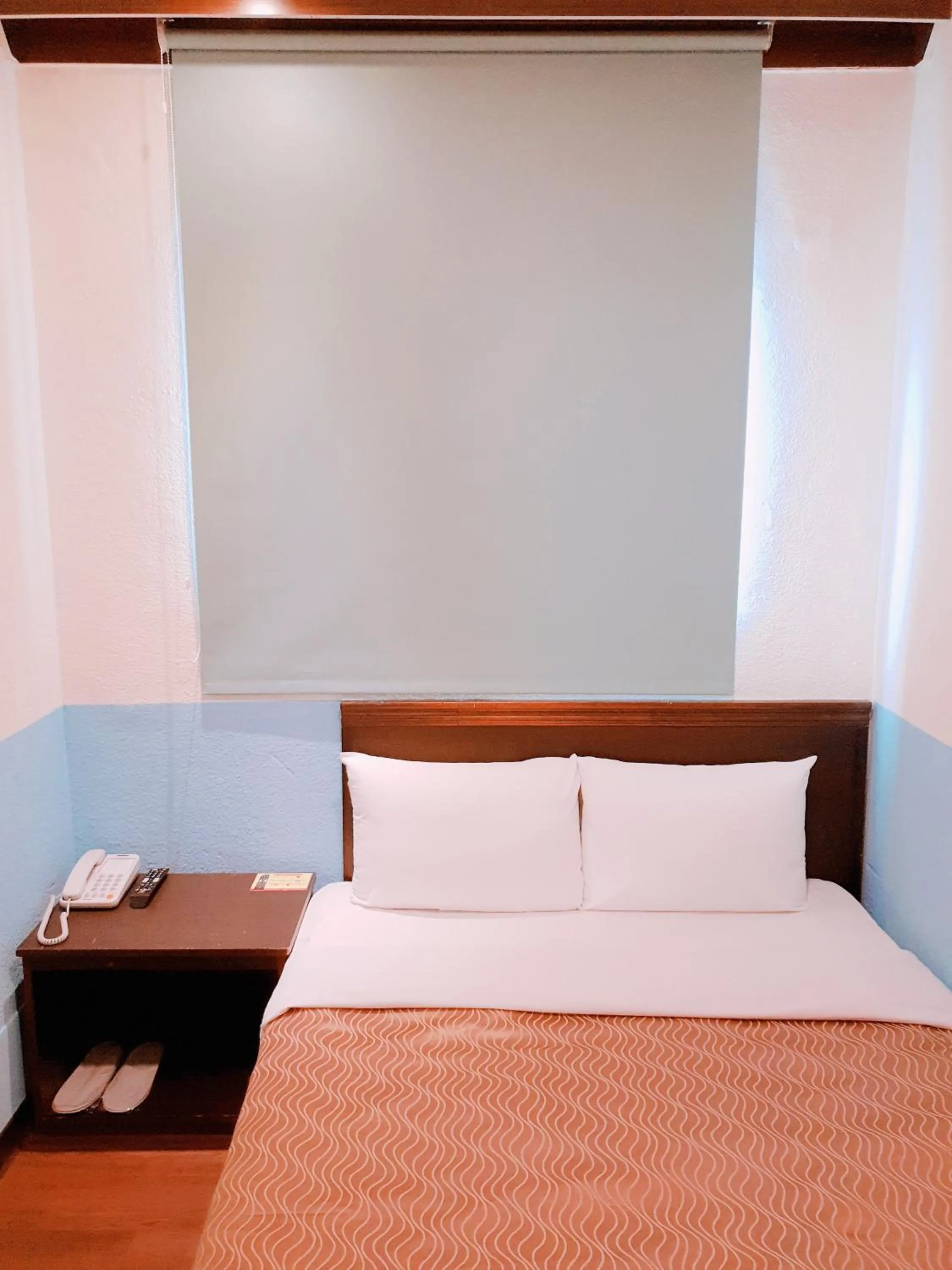 Bed in Blue Ocean Hotel