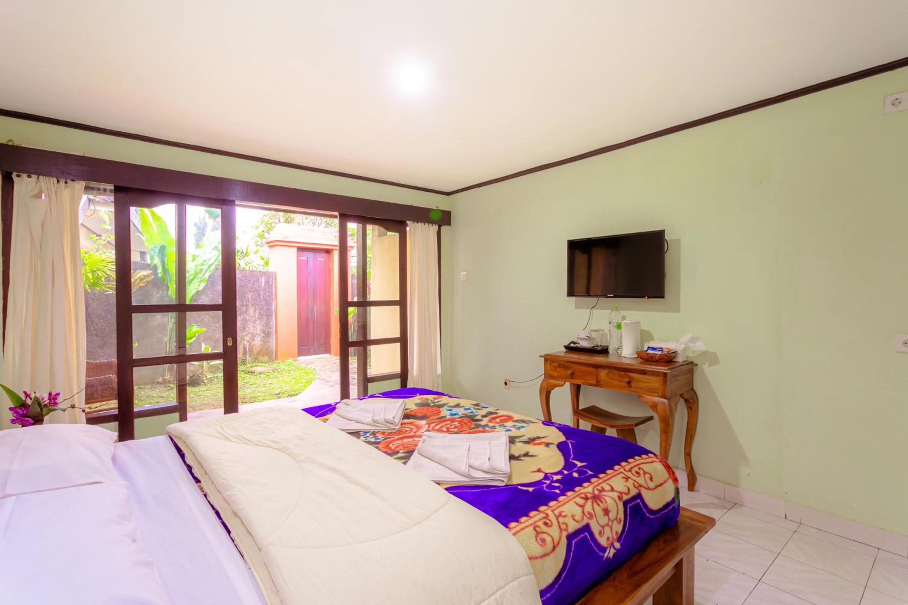 Communal lounge/ TV room, Bed in Pacung Indah Hotel & Restaurant by ecommerceloka