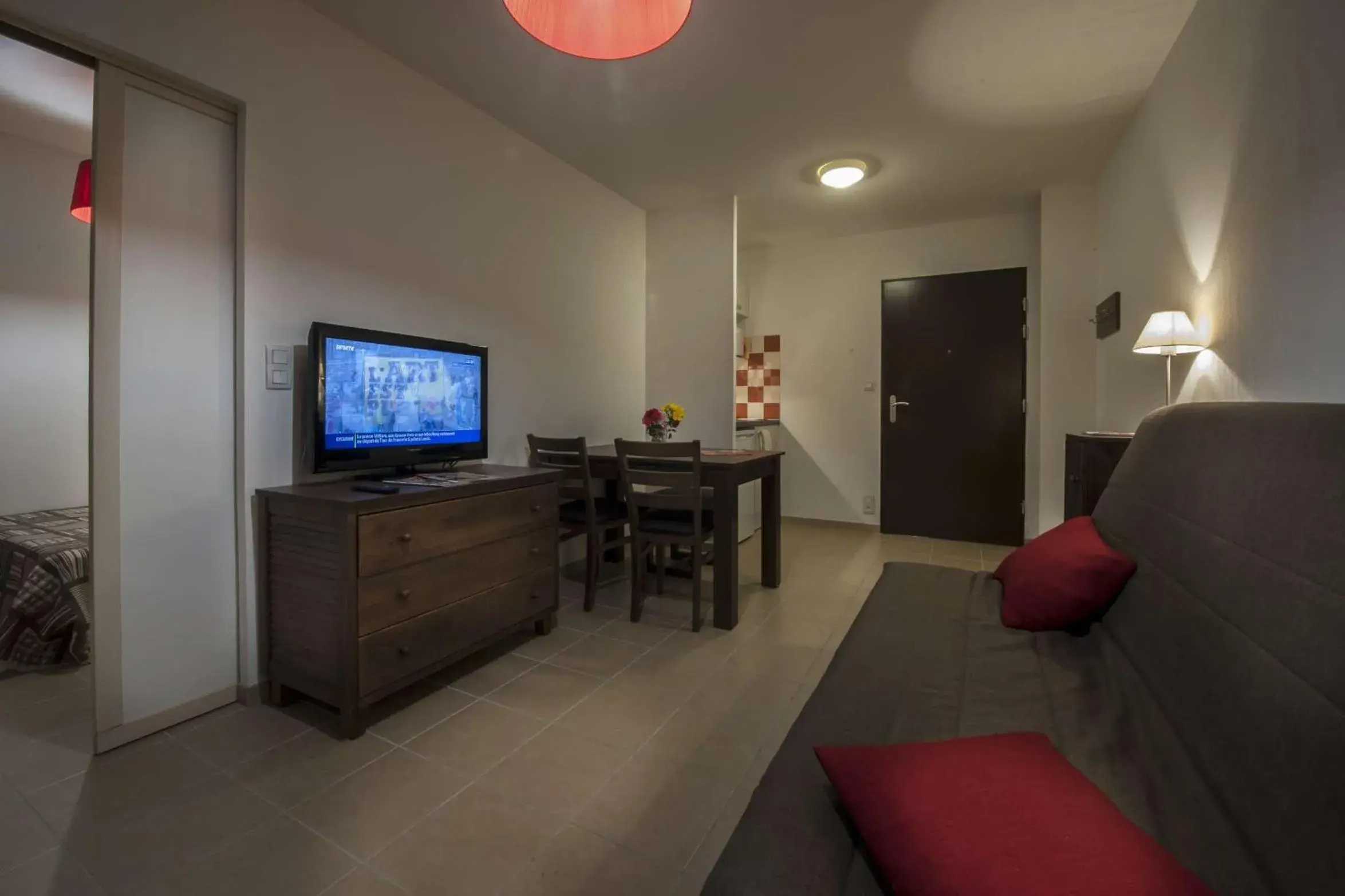 Living room in Vacancéole - Résidence Le Clos du Rocher Living room in Vacancéole - Résidence Le Clos du Rocher