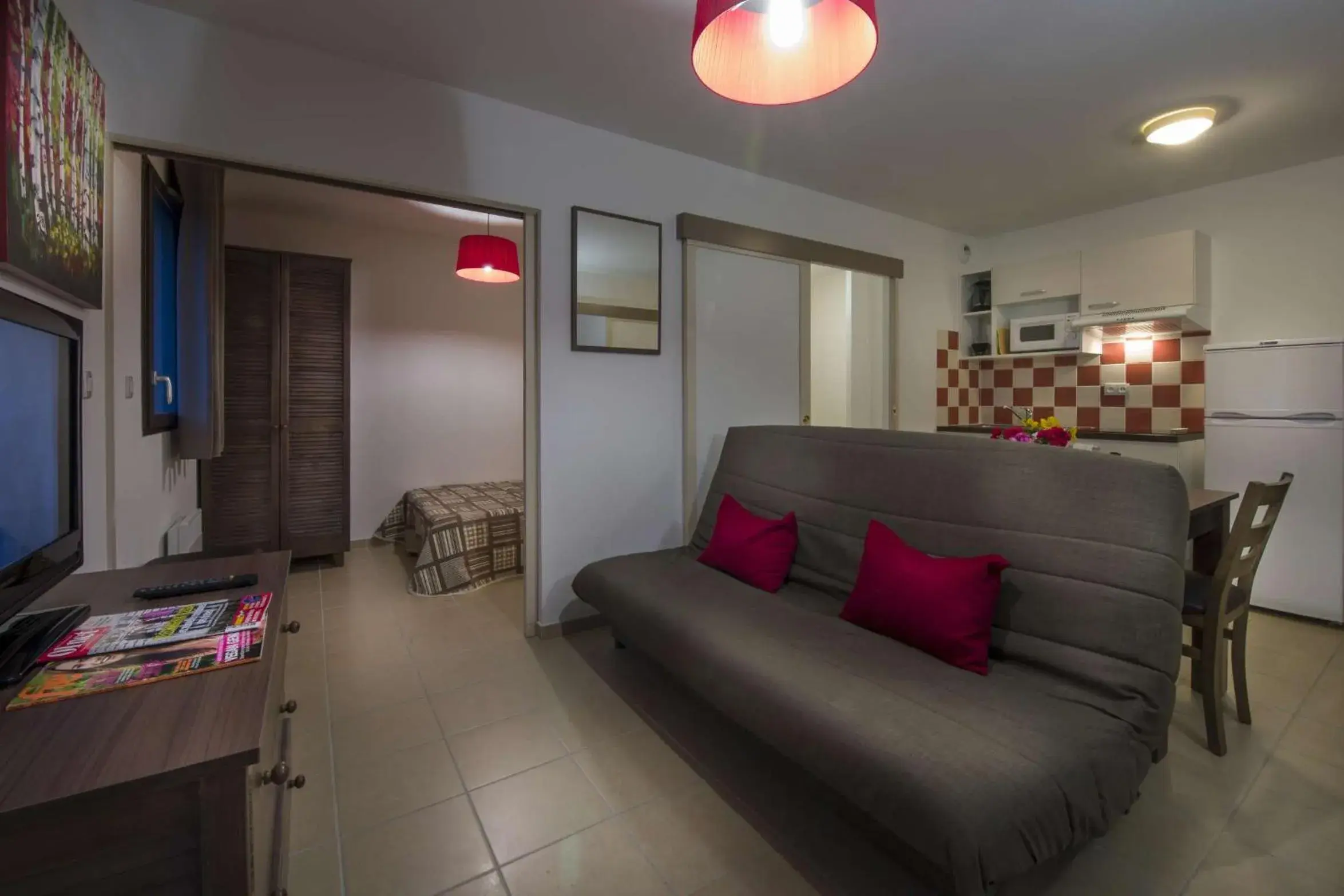 Living room in Vacancéole - Résidence Le Clos du Rocher Living room in Vacancéole - Résidence Le Clos du Rocher