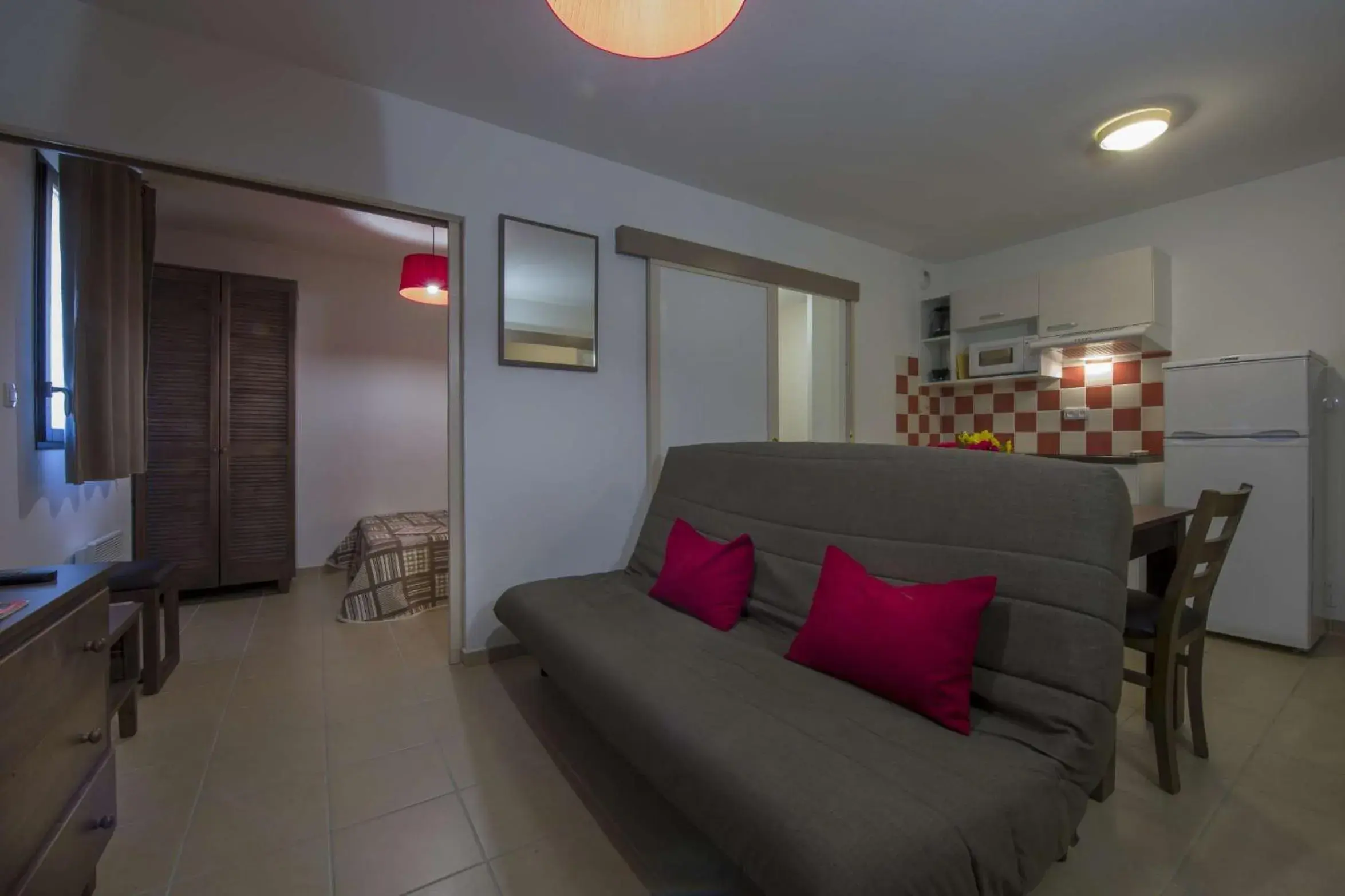 Living room in Vacancéole - Résidence Le Clos du Rocher Living room in Vacancéole - Résidence Le Clos du Rocher