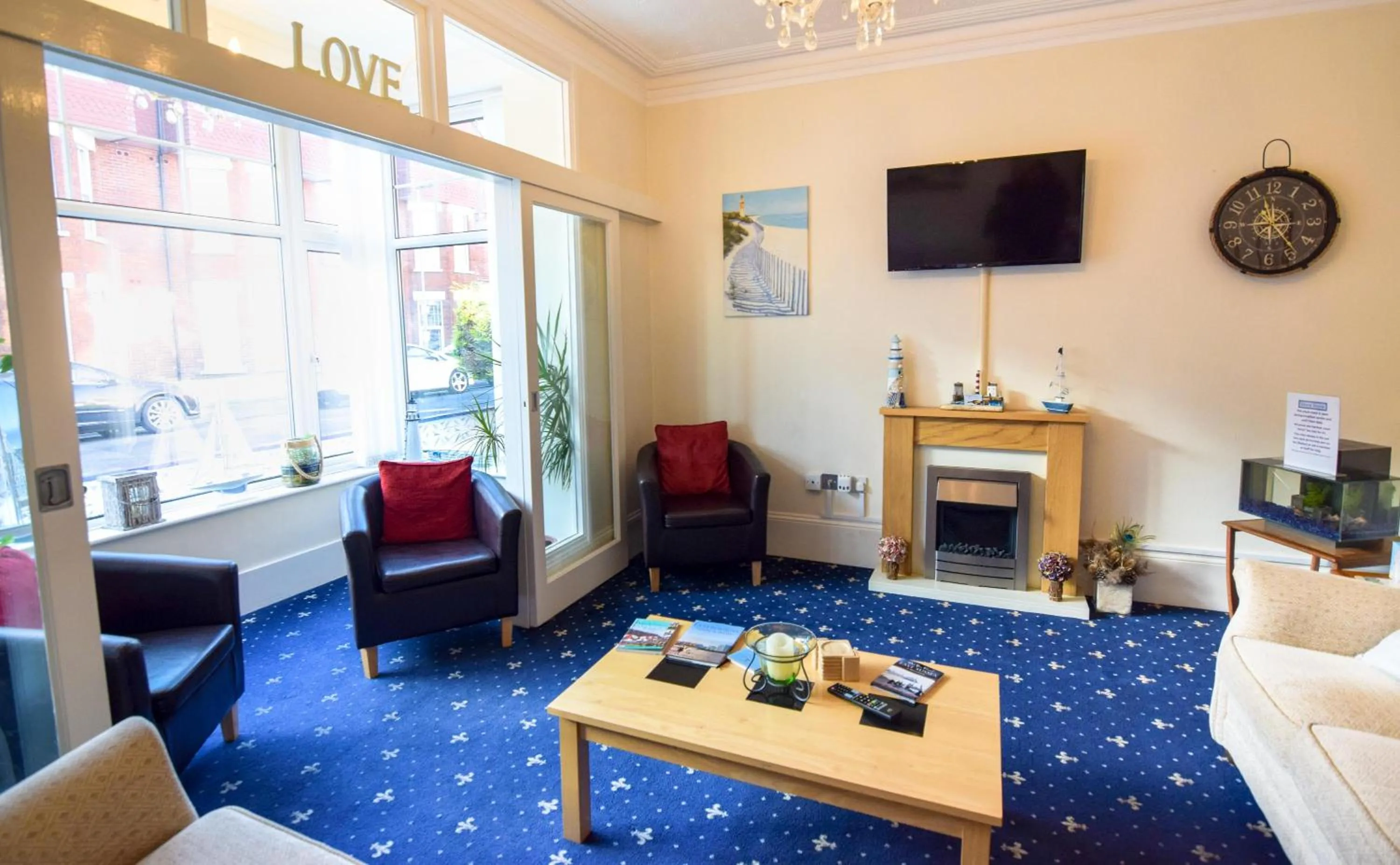 Communal lounge/ TV room in Eastbourne Reymar