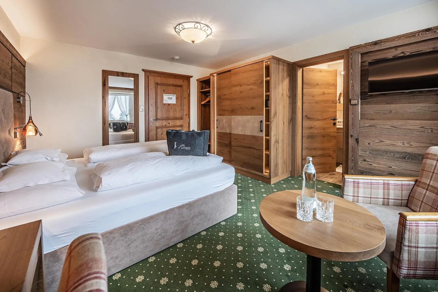 Photo of the whole room, Bed in Naturhotel Alpenblick