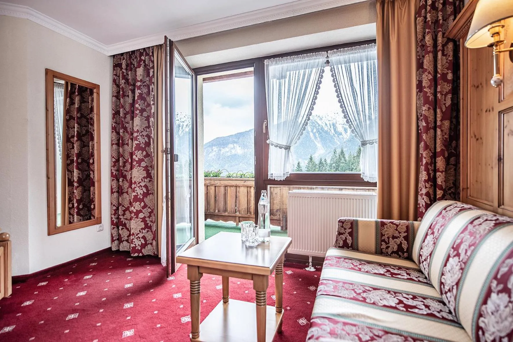 Seating area, Bed in Naturhotel Alpenblick