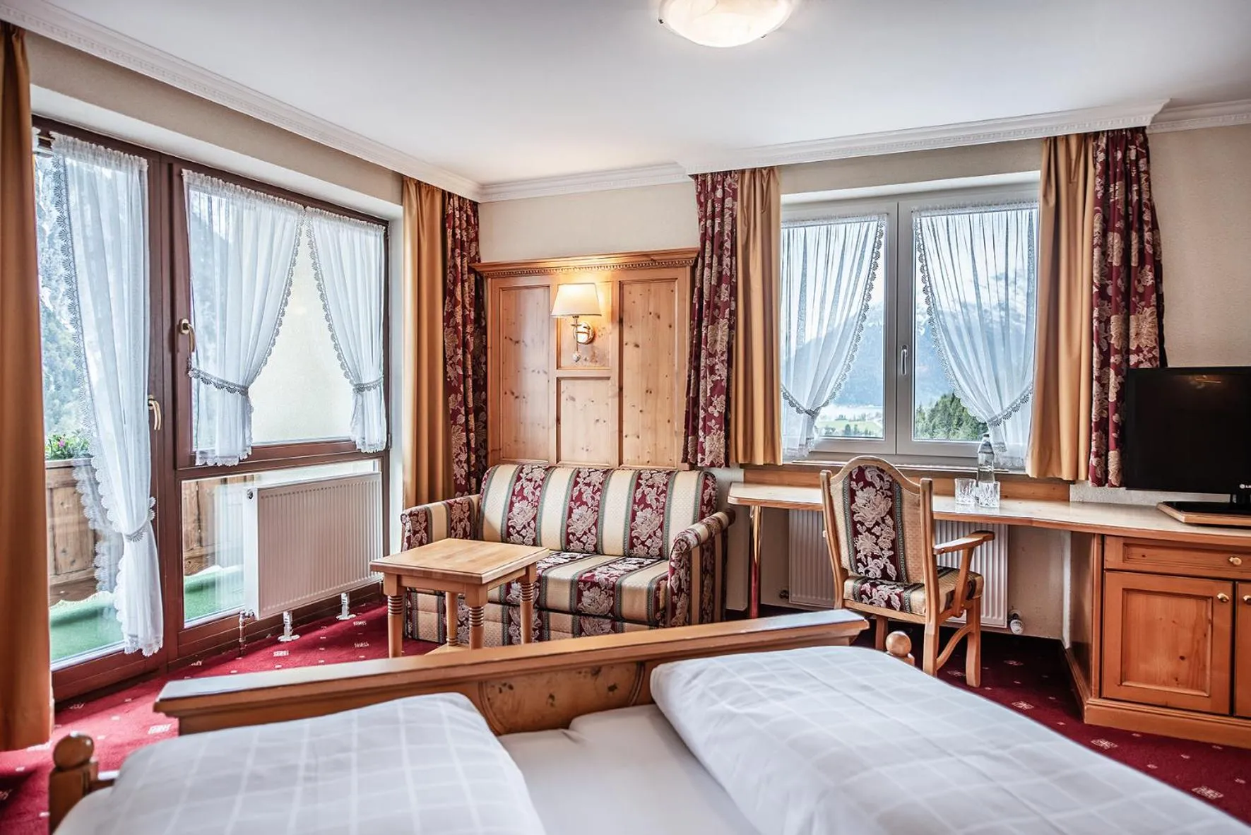 Photo of the whole room, Bed in Naturhotel Alpenblick