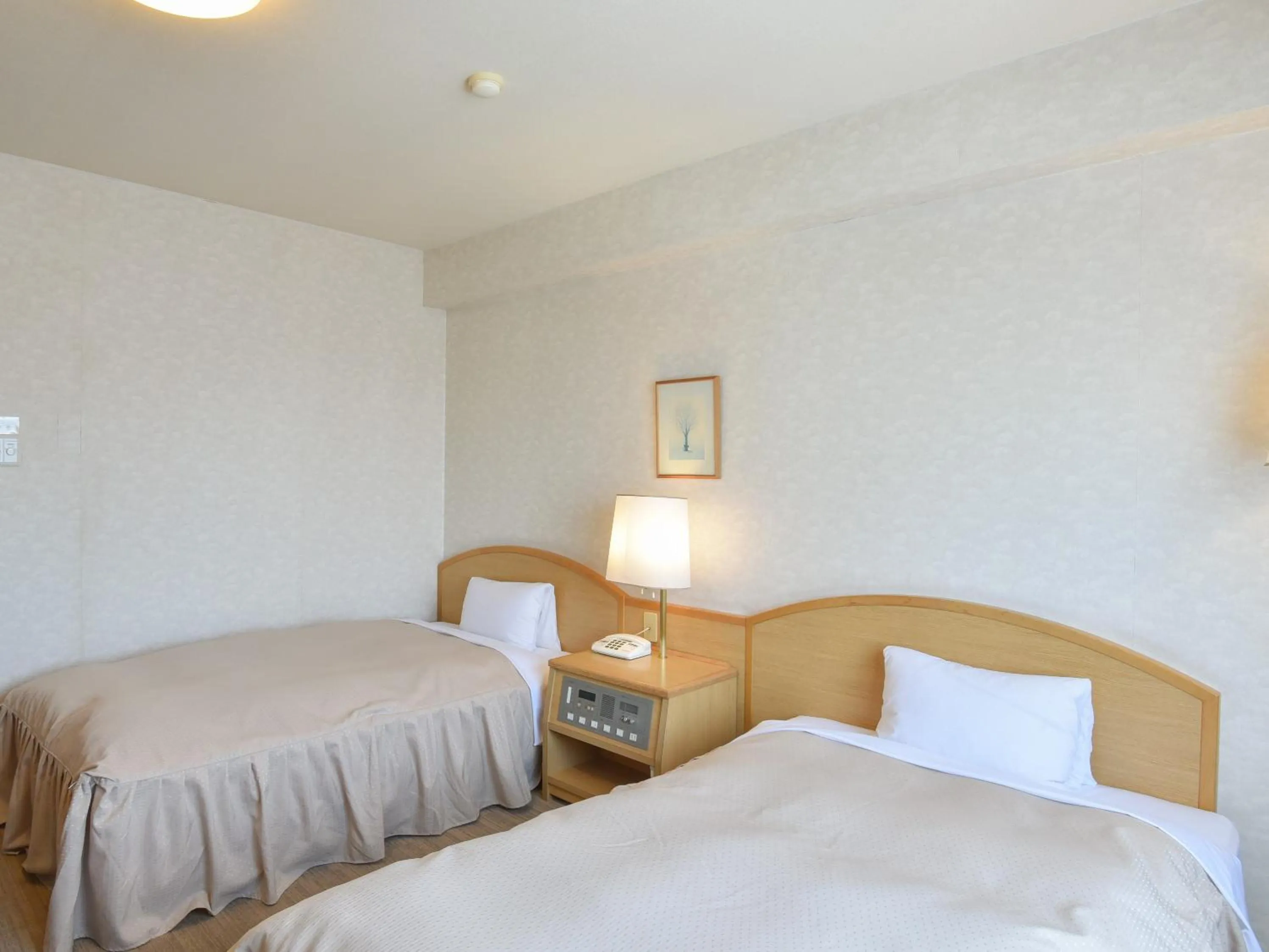 Bed in Yokkaichi City Hotel Annex