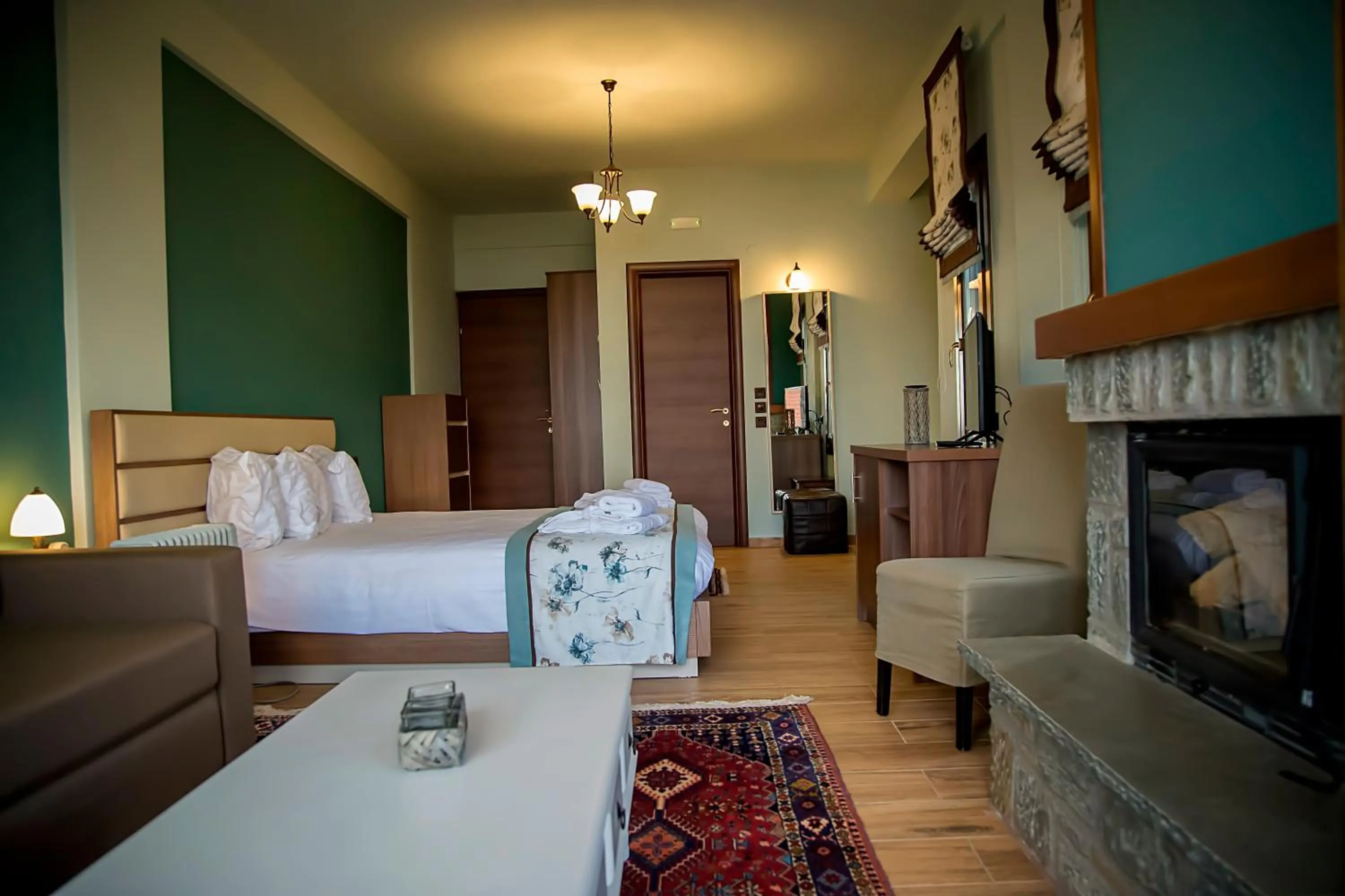 Seating area, Bed in Pandion Luxury Boutique Hotel & Suites with Spa