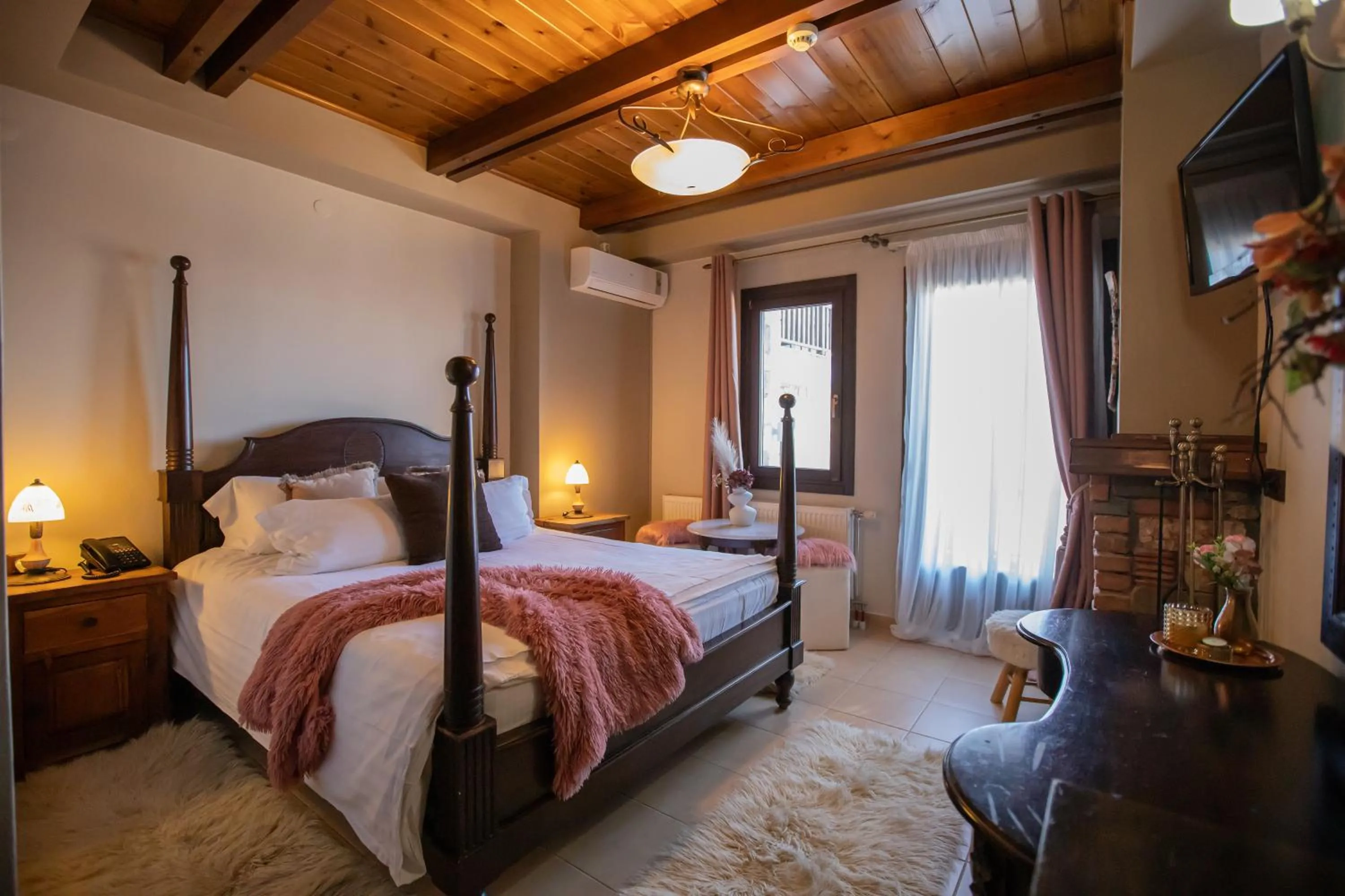Bed in Pandion Luxury Boutique Hotel & Suites with Spa